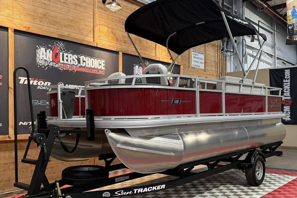2026 Sun Tracker Bass Buggy 18 DLX pontoon boat displayed indoors.