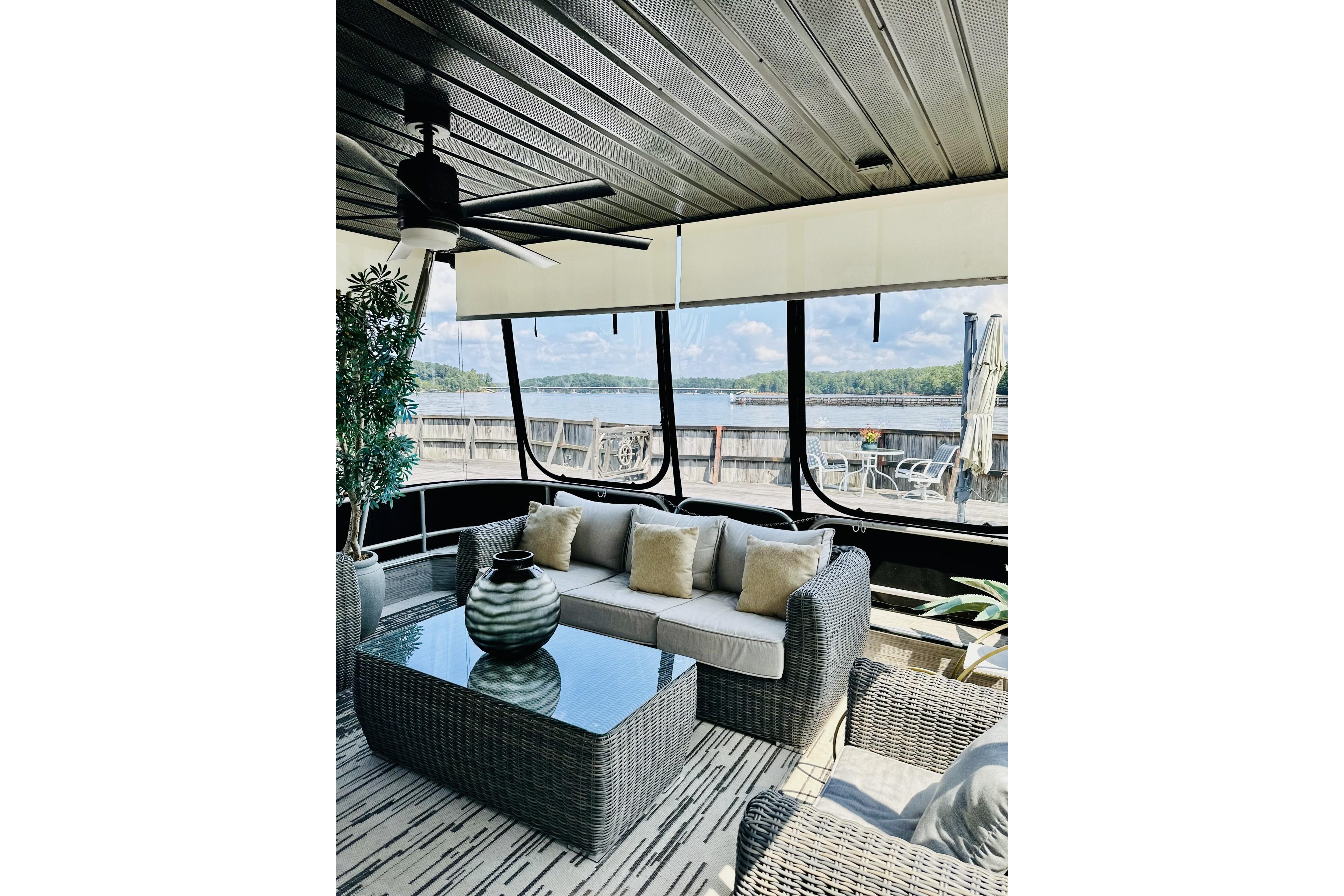 Luxurious 1992 Sumerset 66 houseboat interior with modern seating and scenic lake view.