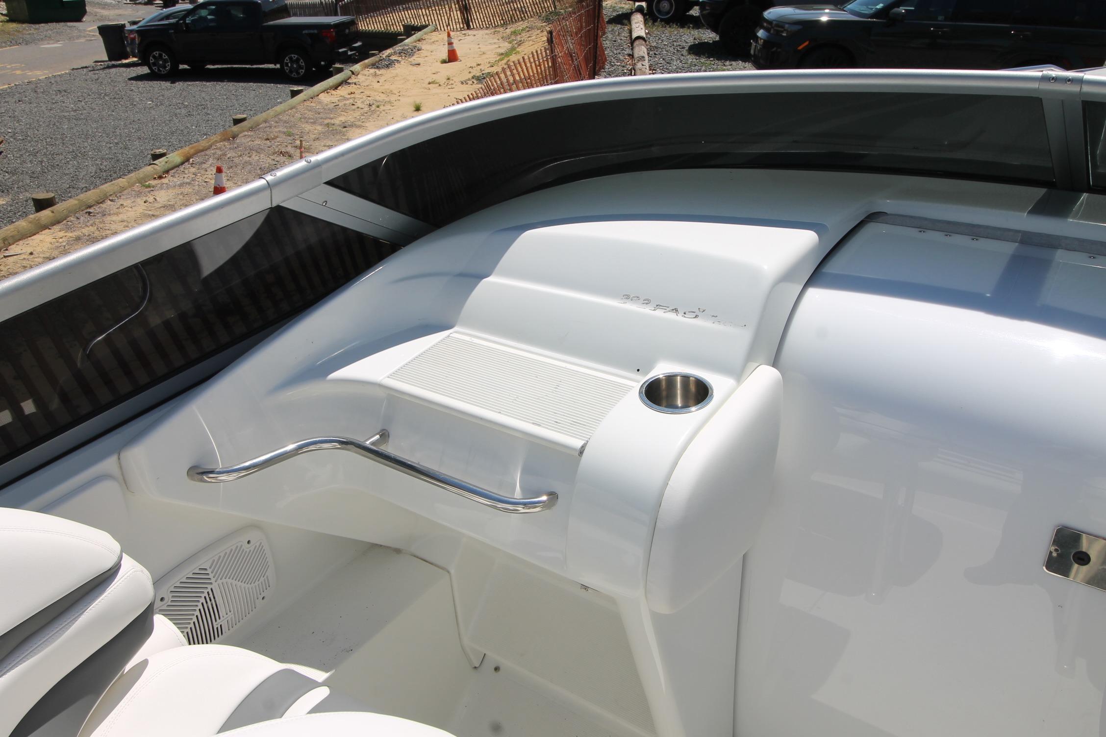 2006 Formula 292 FASTech boat interior with cup holder and seating area.