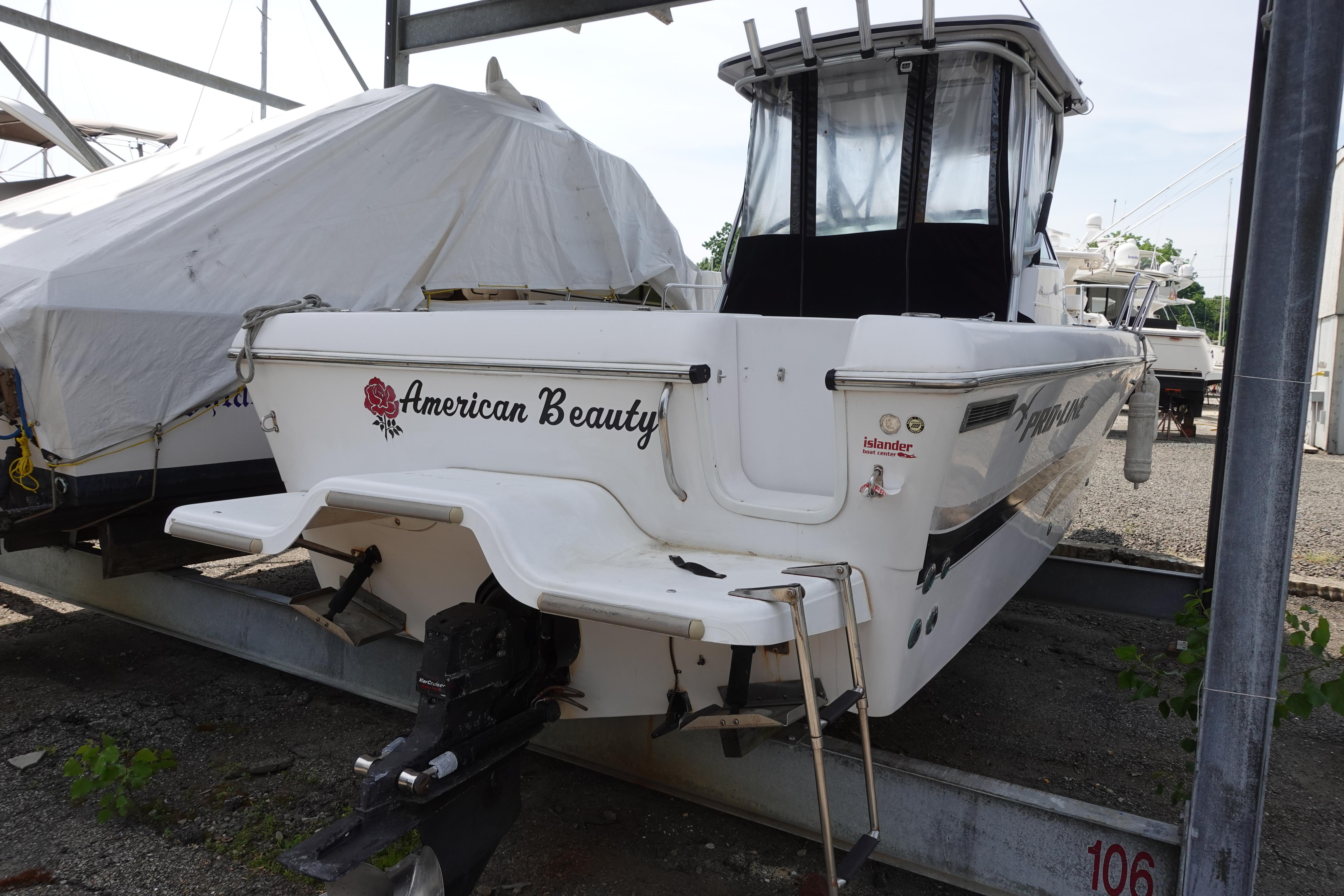 2000 Pro-Line 24 Walk boat named "American Beauty" in storage.