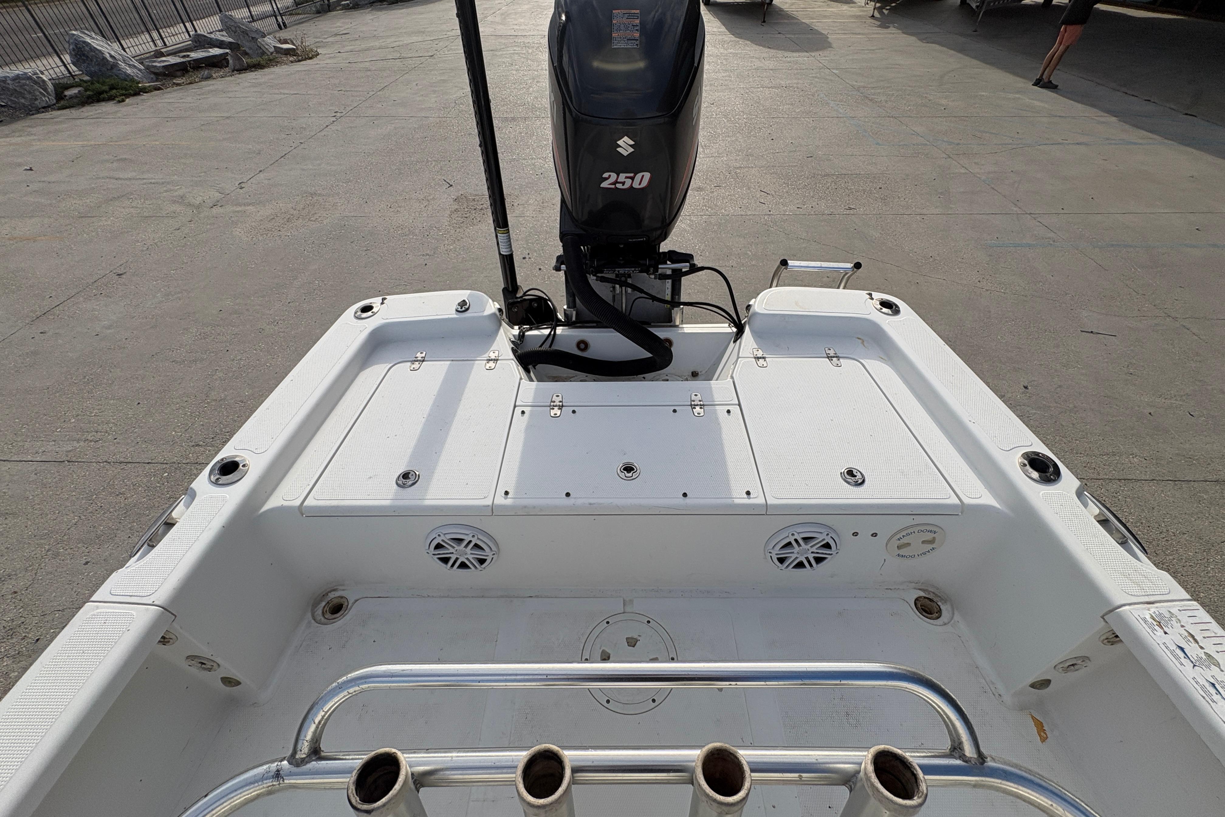 2012 BlackJack 224 boat with Suzuki 250 engine, featuring spacious deck and rod holders.