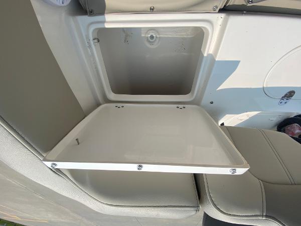 2024 Key West 203 FS boat storage compartment with open lid.