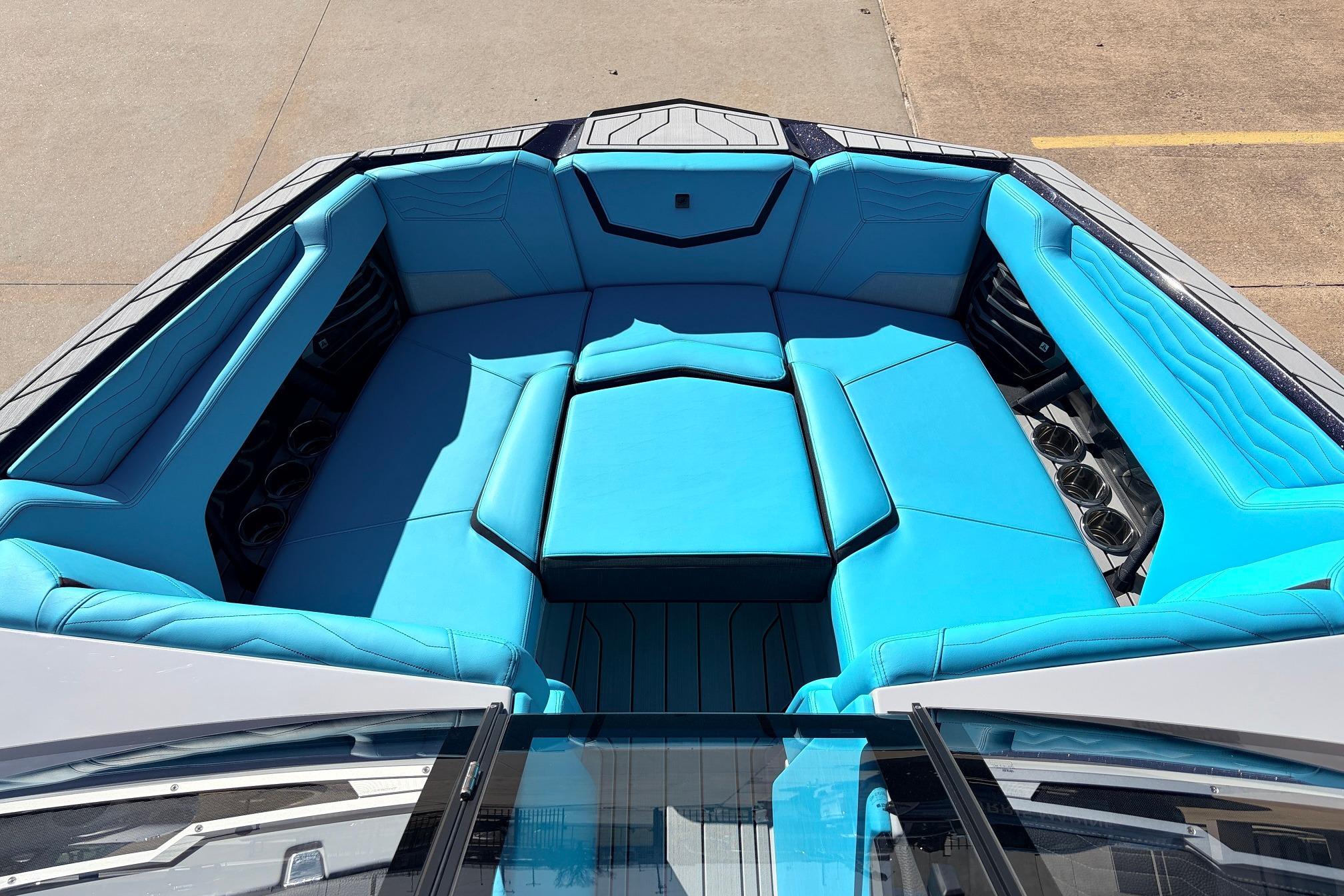2026 Nautique Super Air Nautique G23 boat interior with vibrant blue seating.