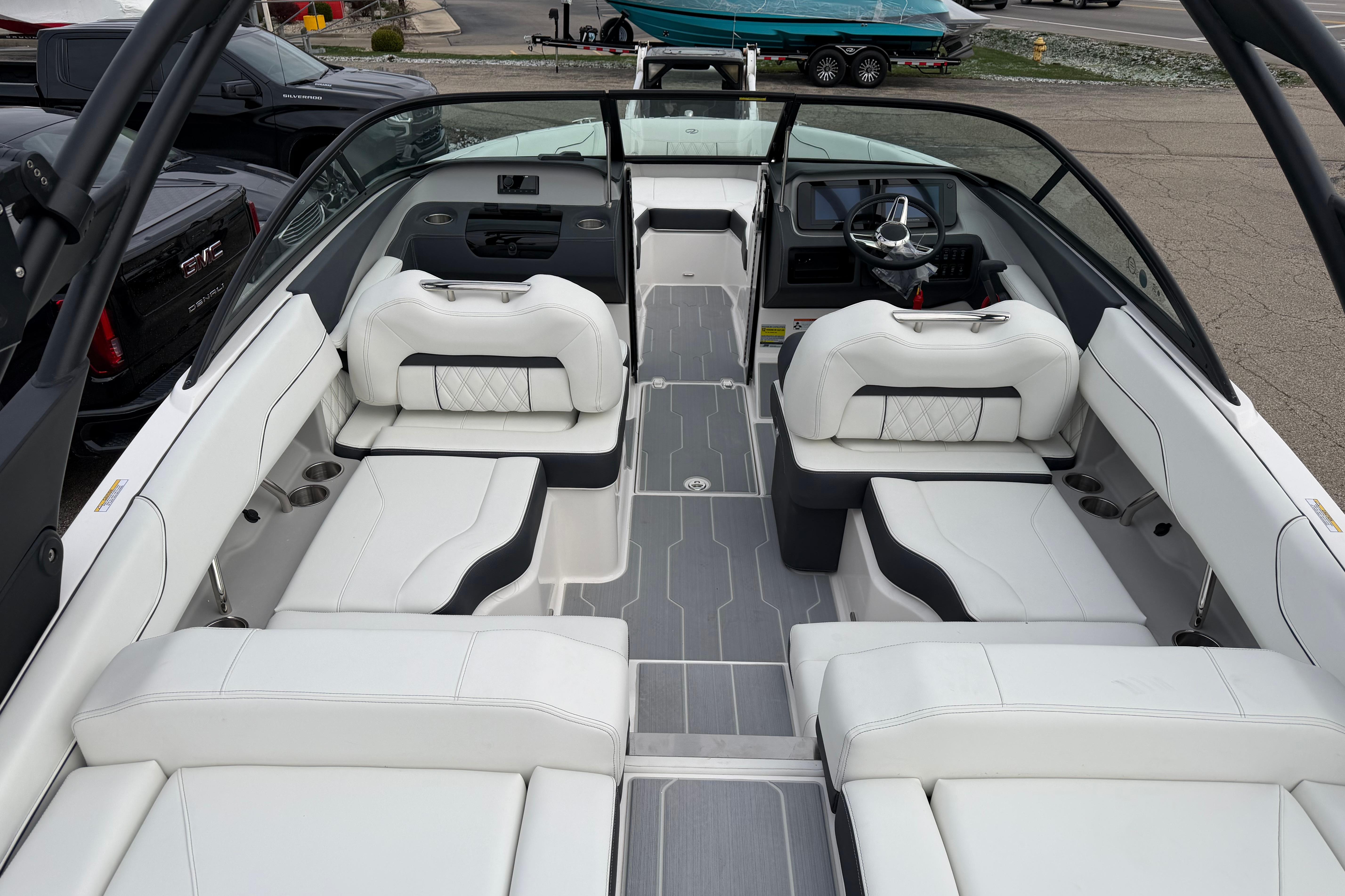 2026 Regal LS2 Surf boat interior with luxurious white seating and modern dashboard.
