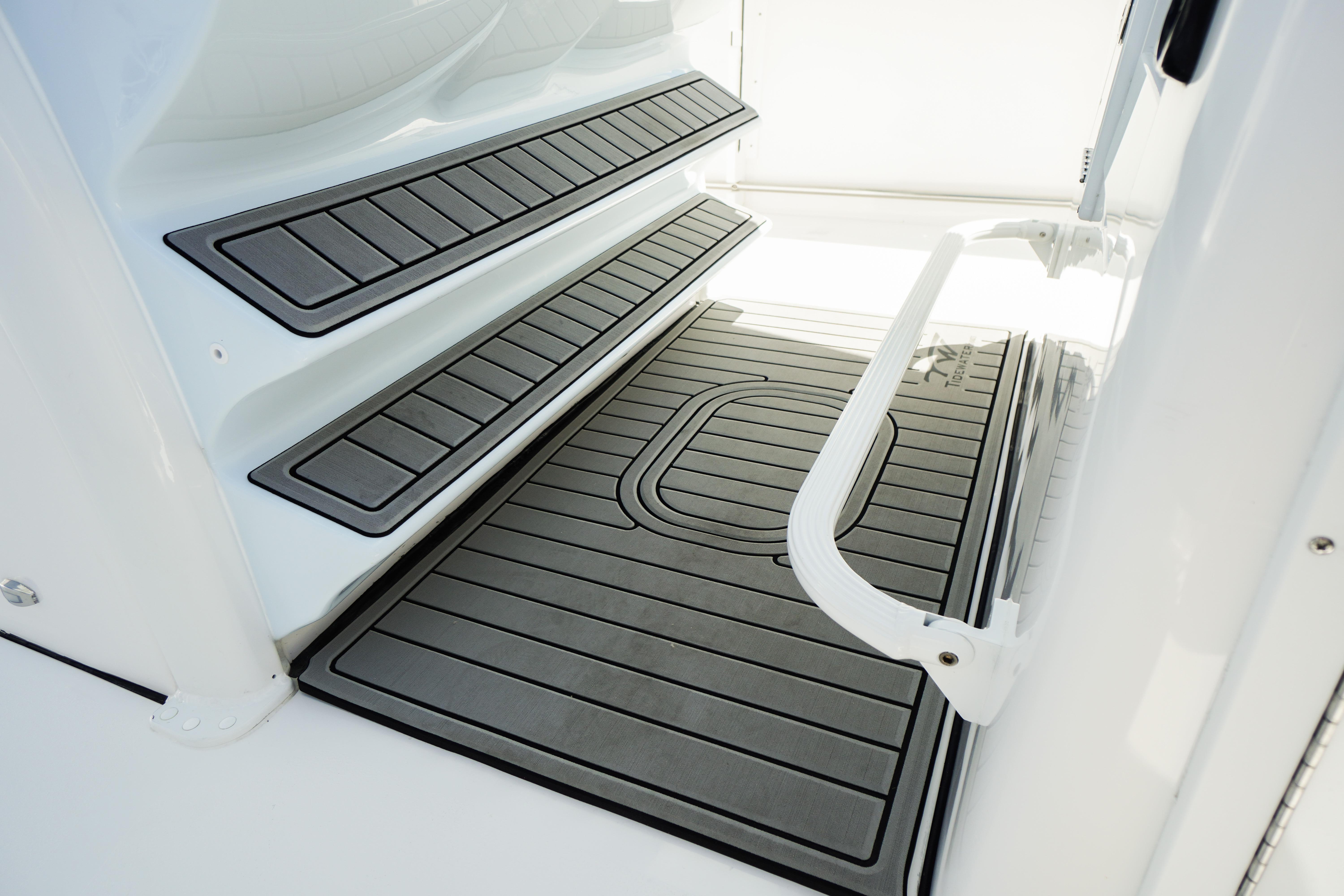 2026 Tidewater 302 CC Adventure boat interior with non-slip flooring and handrail.
