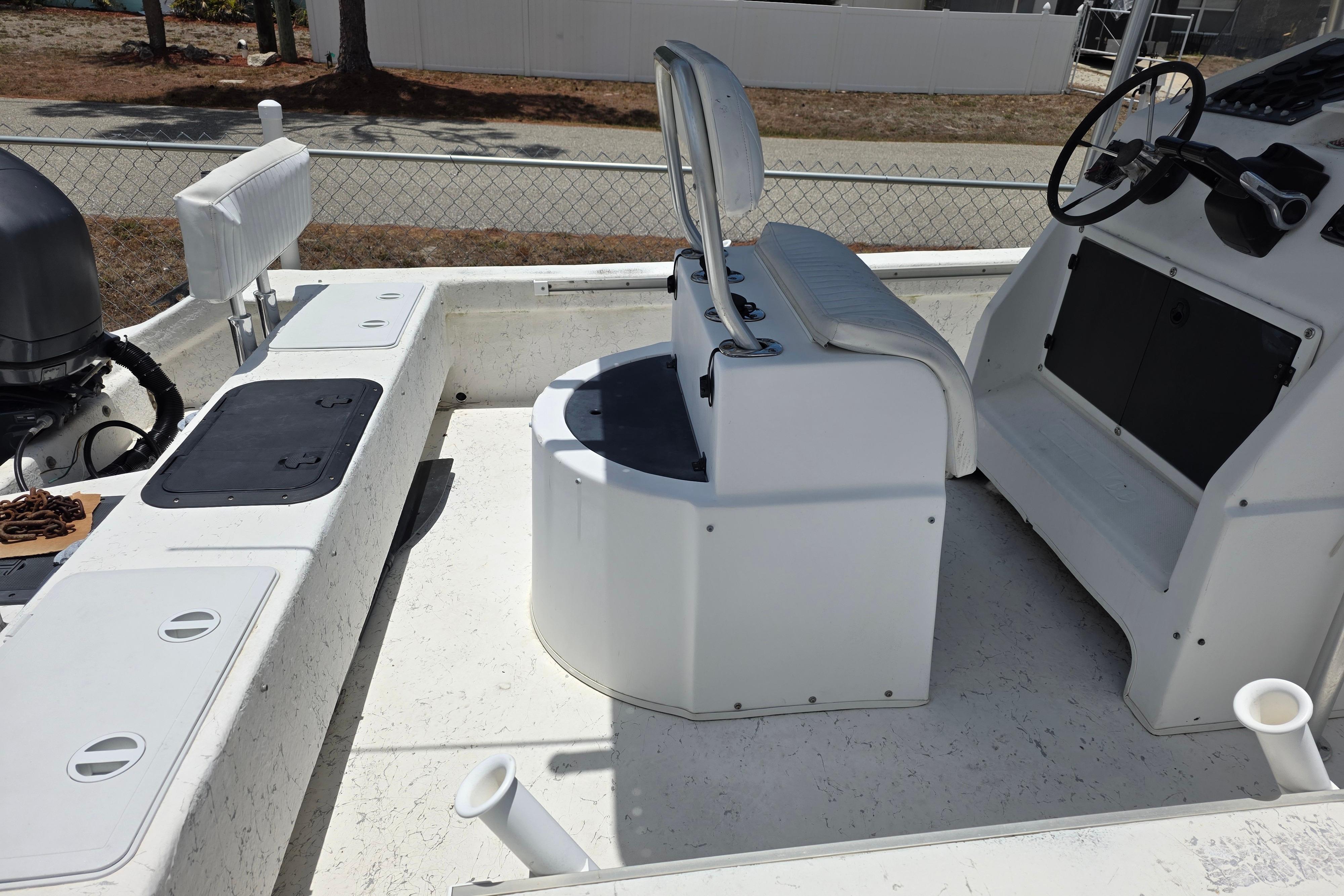 1999 Twin Vee Awesome 22 boat interior with steering console and seating.