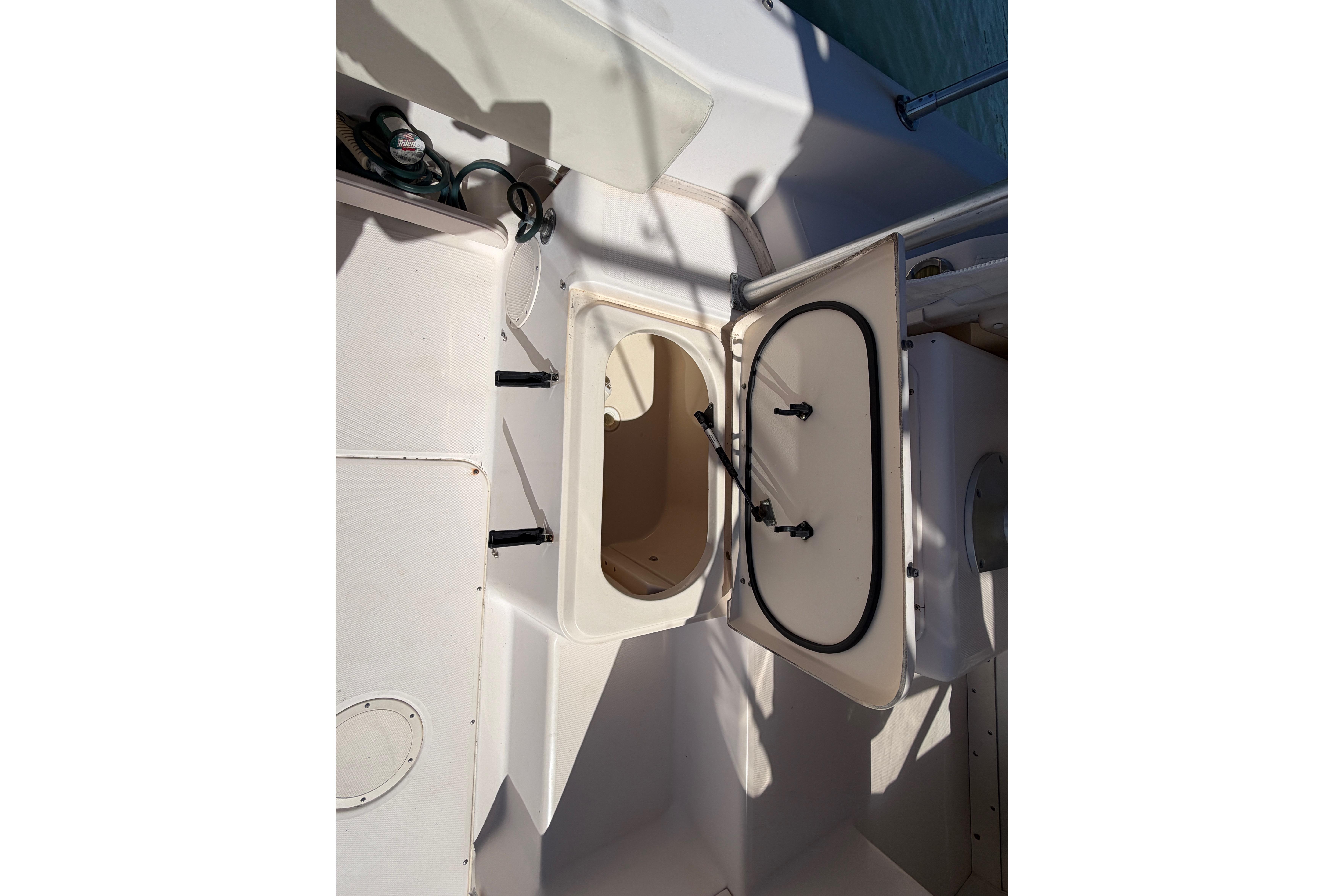 2006 Grady-White Sailfish 282 boat interior with open storage compartment.