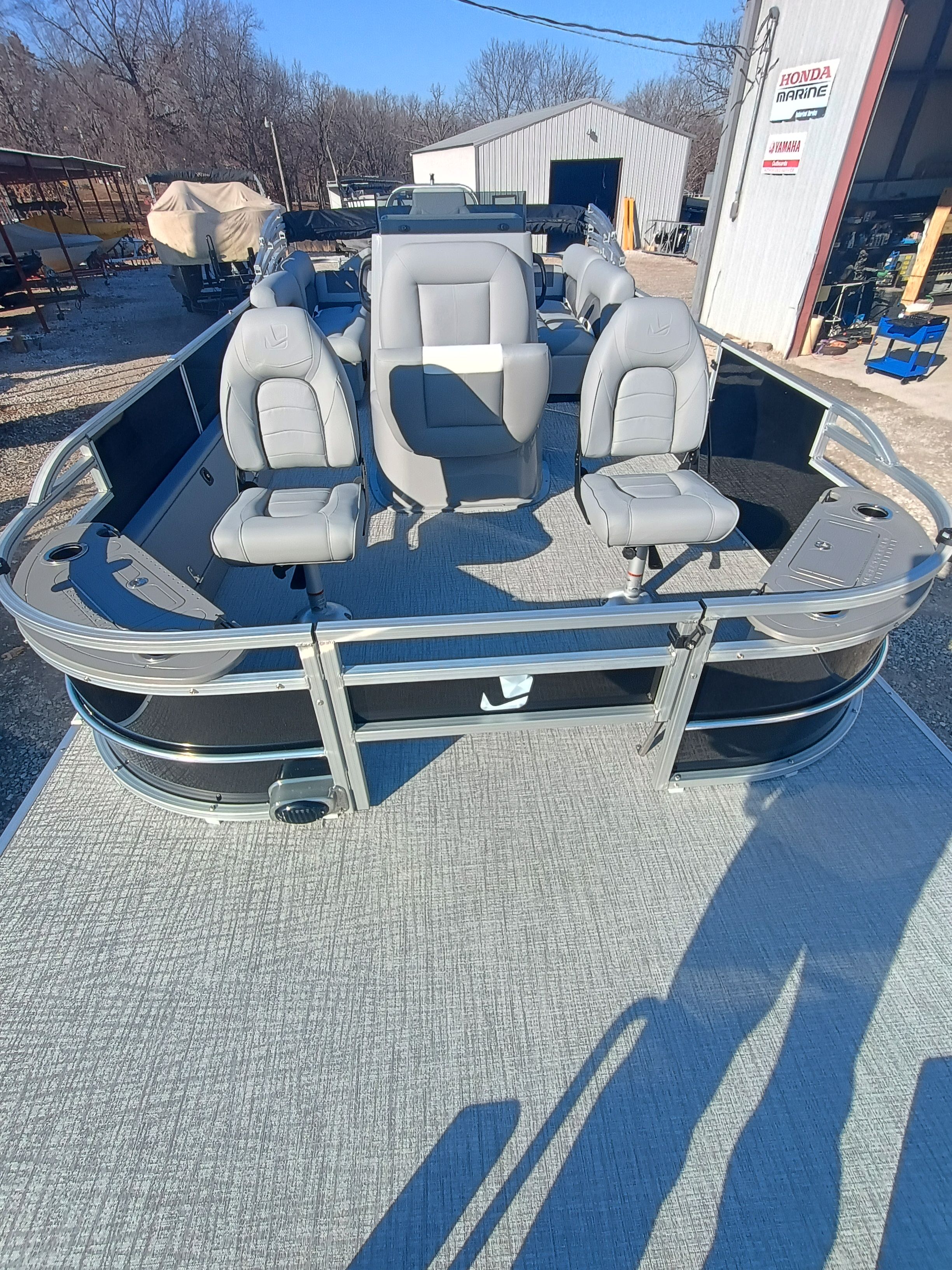 2026 Landau Alure 25CC Fish-Black pontoon boat with gray seats.