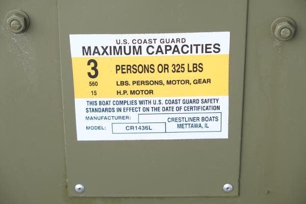 Capacity label on 2024 Crestliner 1436L CR Jon boat, showing maximum 3 persons or 325 lbs.