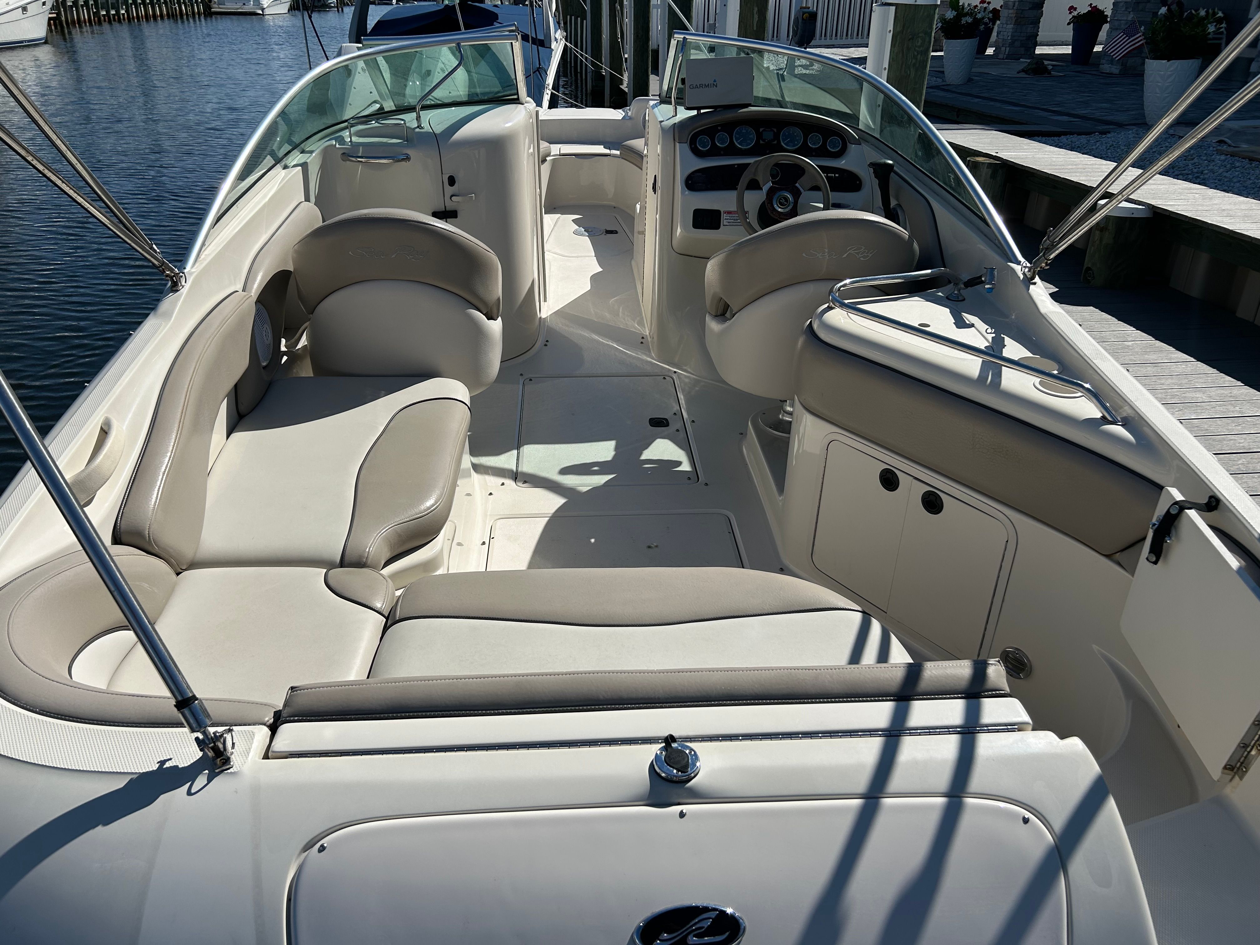 Interior of a 2003 Sea Ray 240 Sundeck boat at the dock.
