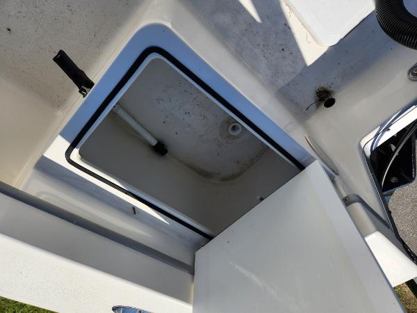 Open storage compartment on 2023 May-Craft 208 CC boat.