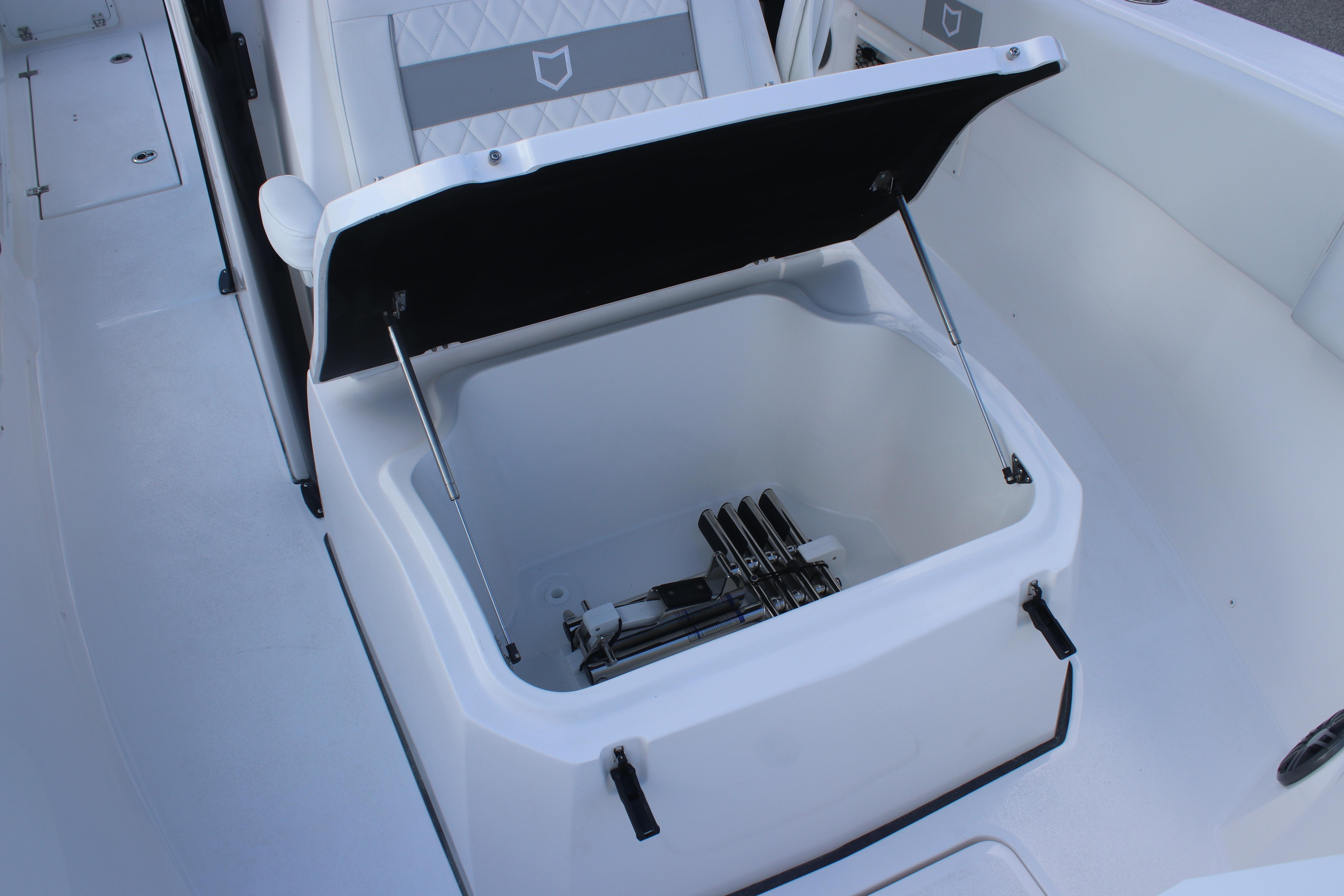 Open storage compartment on 2026 Sea Fox 268 Commander boat, showcasing interior space.