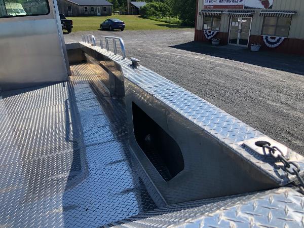 The image shows a workboat deck with a non-slip metal floor.