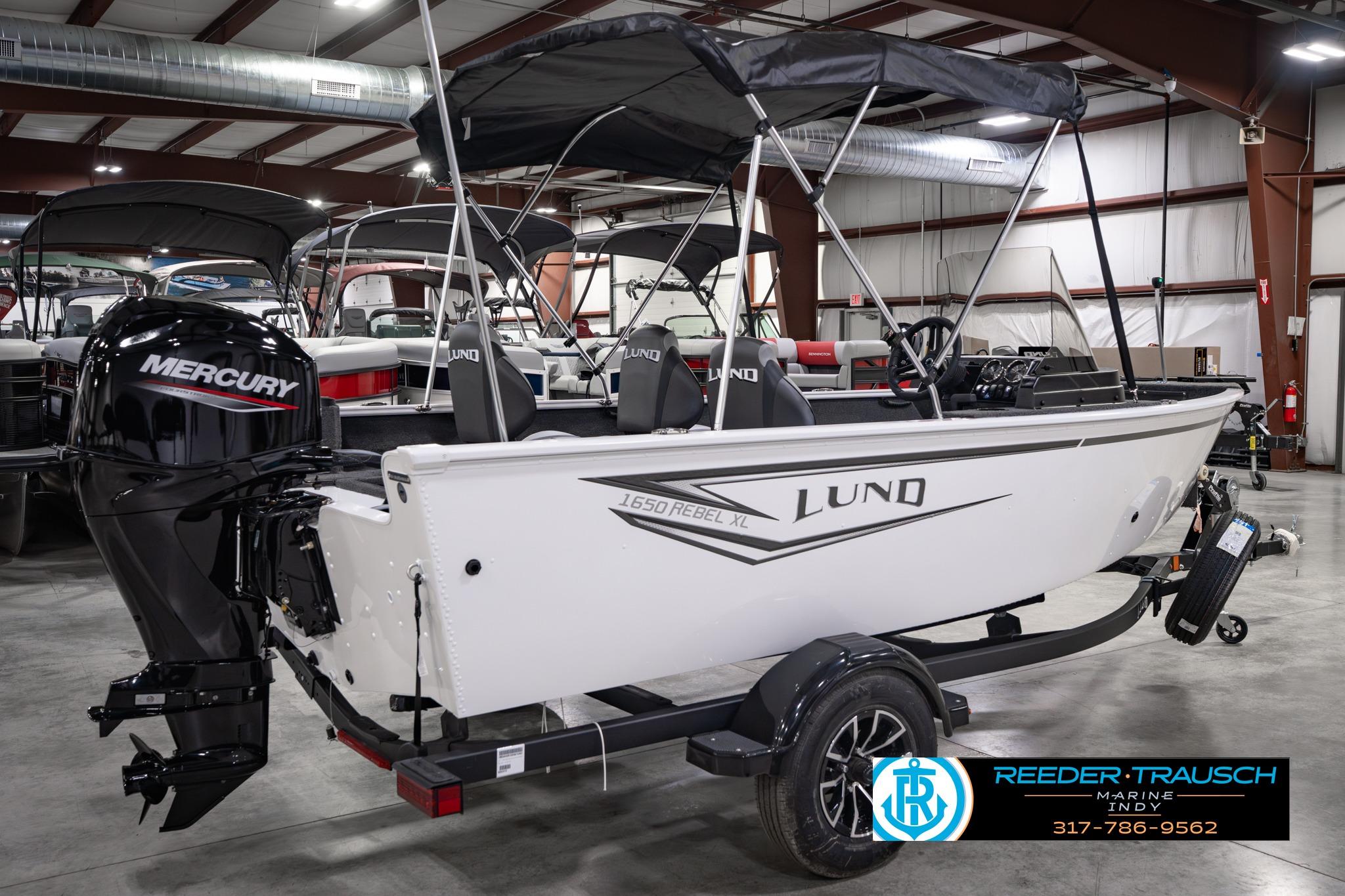 2026 Lund 1650 Rebel XL SS boat with Mercury engine in showroom.
