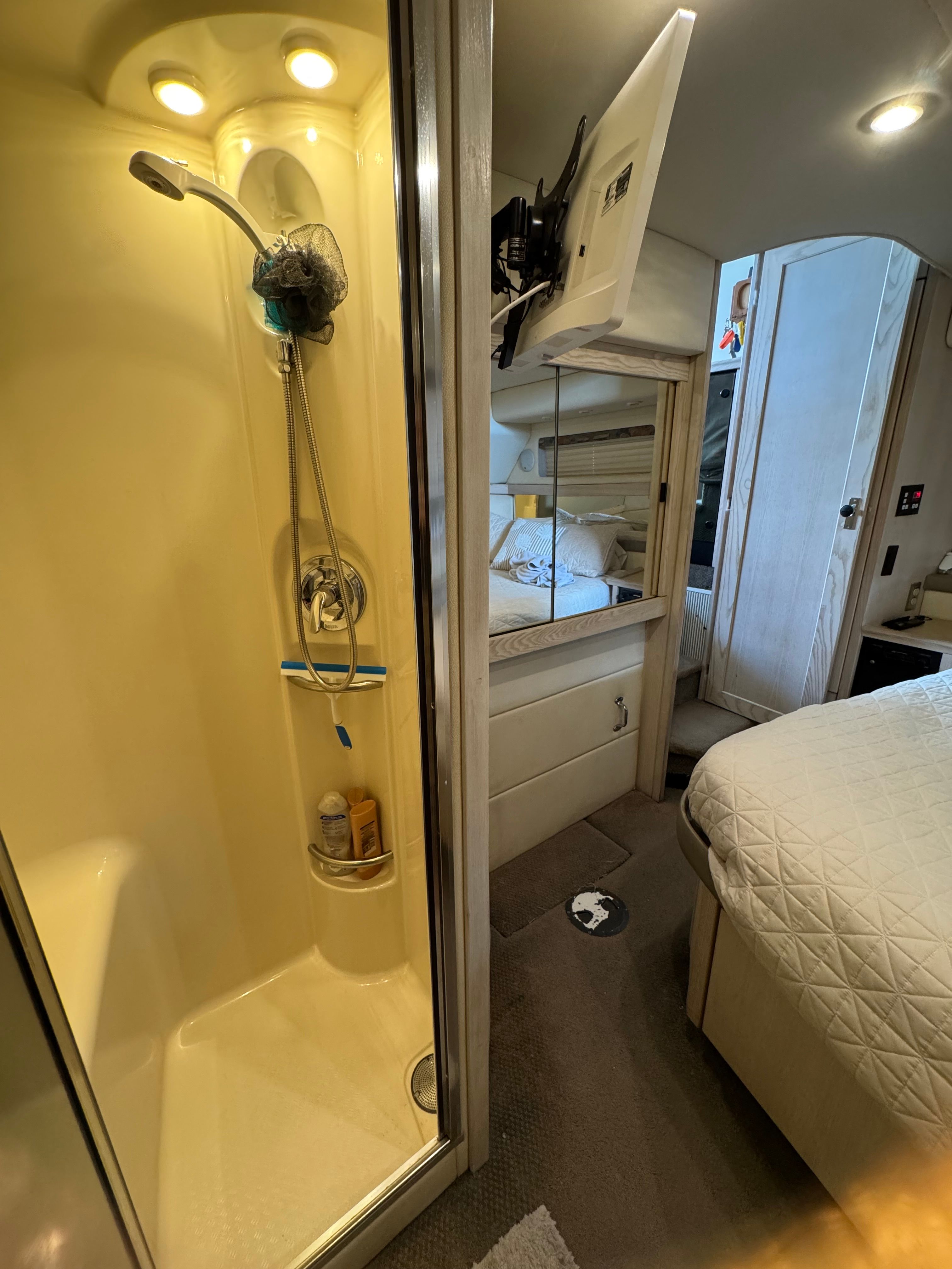 Interior of Bayliner 3587 yacht with shower and bed.