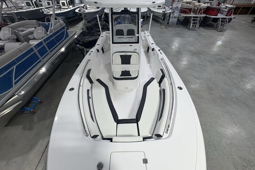 2026 Tidewater 232 CC Adventure boat with sleek white design in showroom.