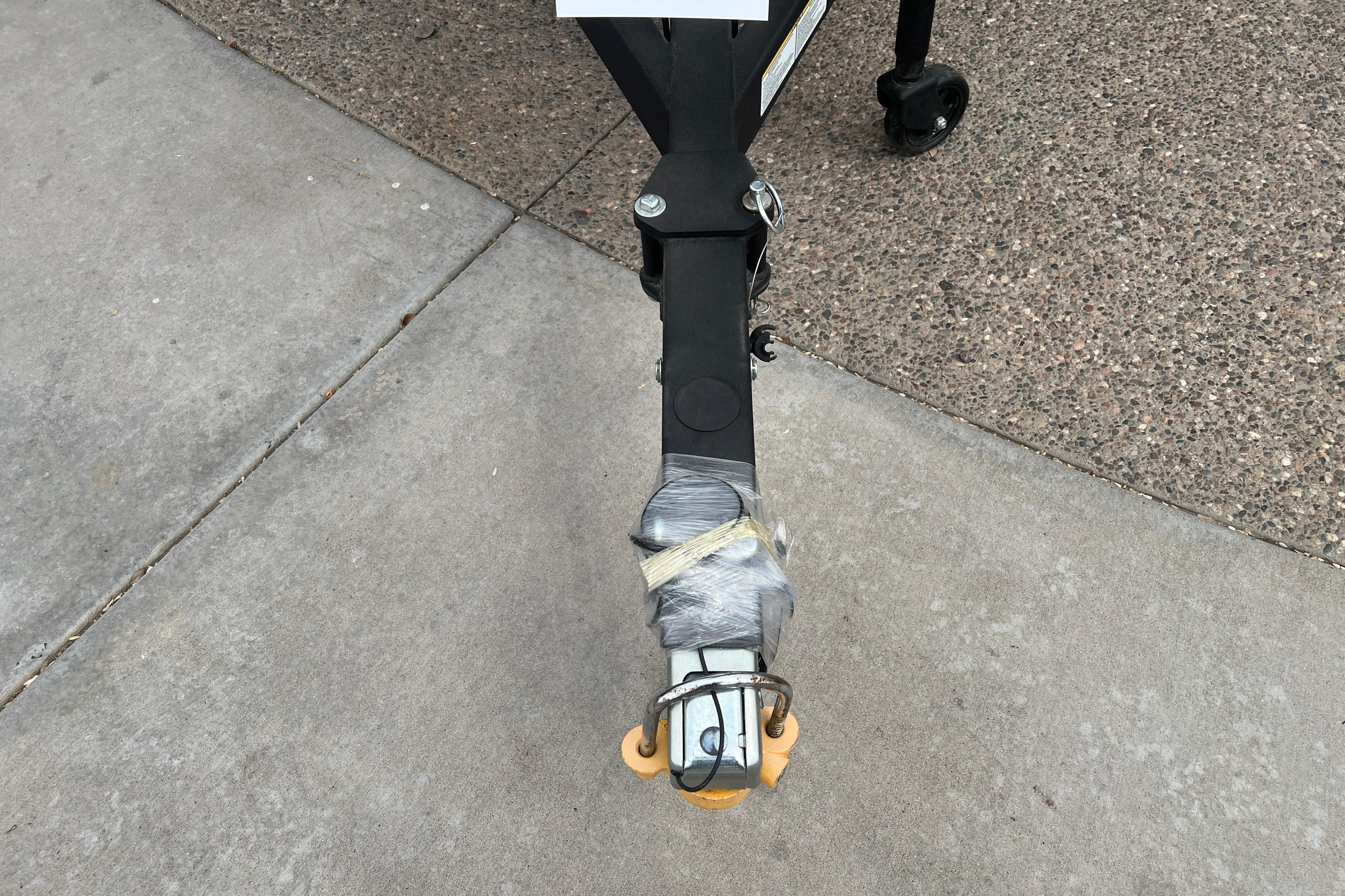Trailer hitch of 2026 Ranger VS1682SC Angler boat on concrete surface.