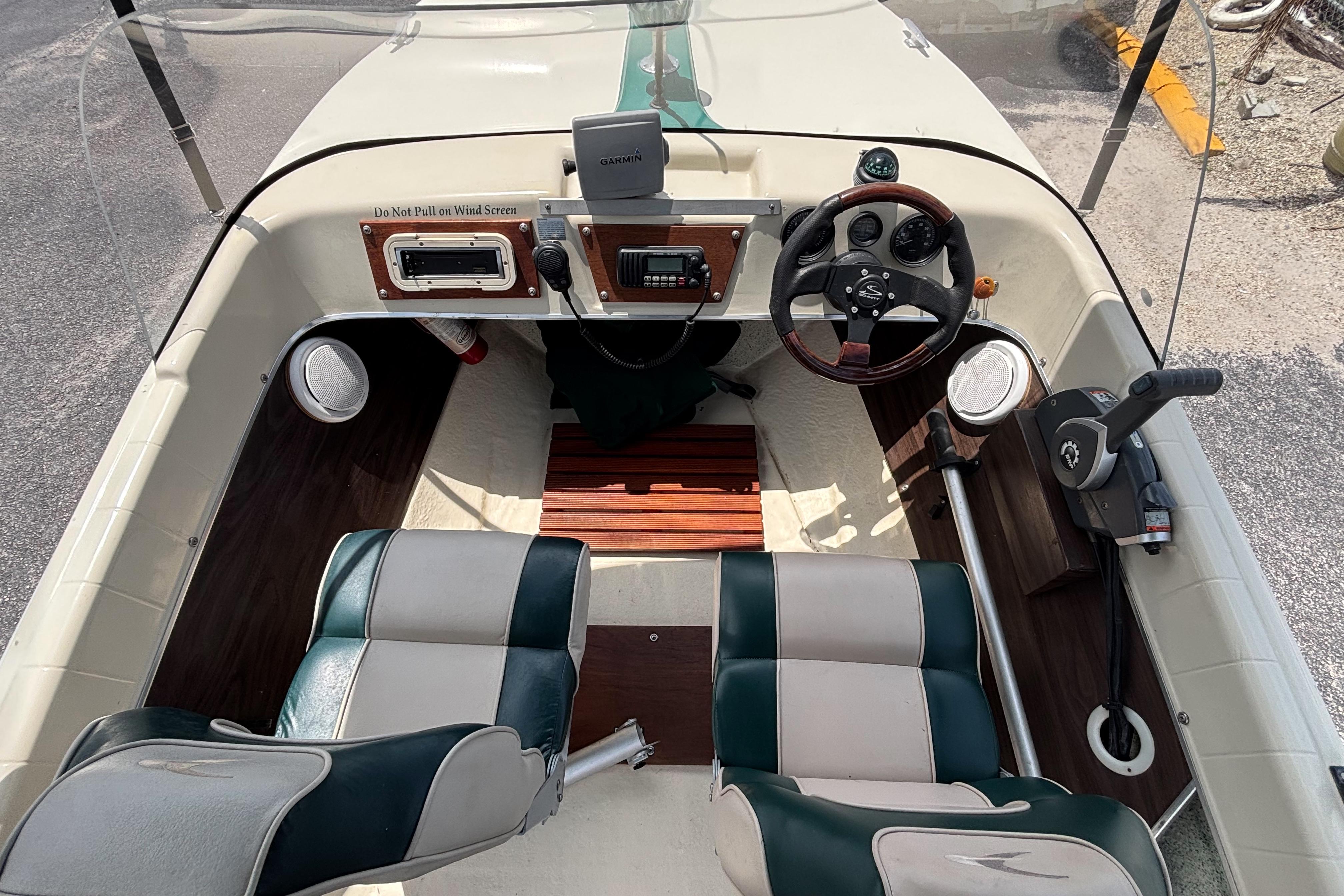 Interior of a 1966 Mohawk 15 boat with vintage steering and seating.