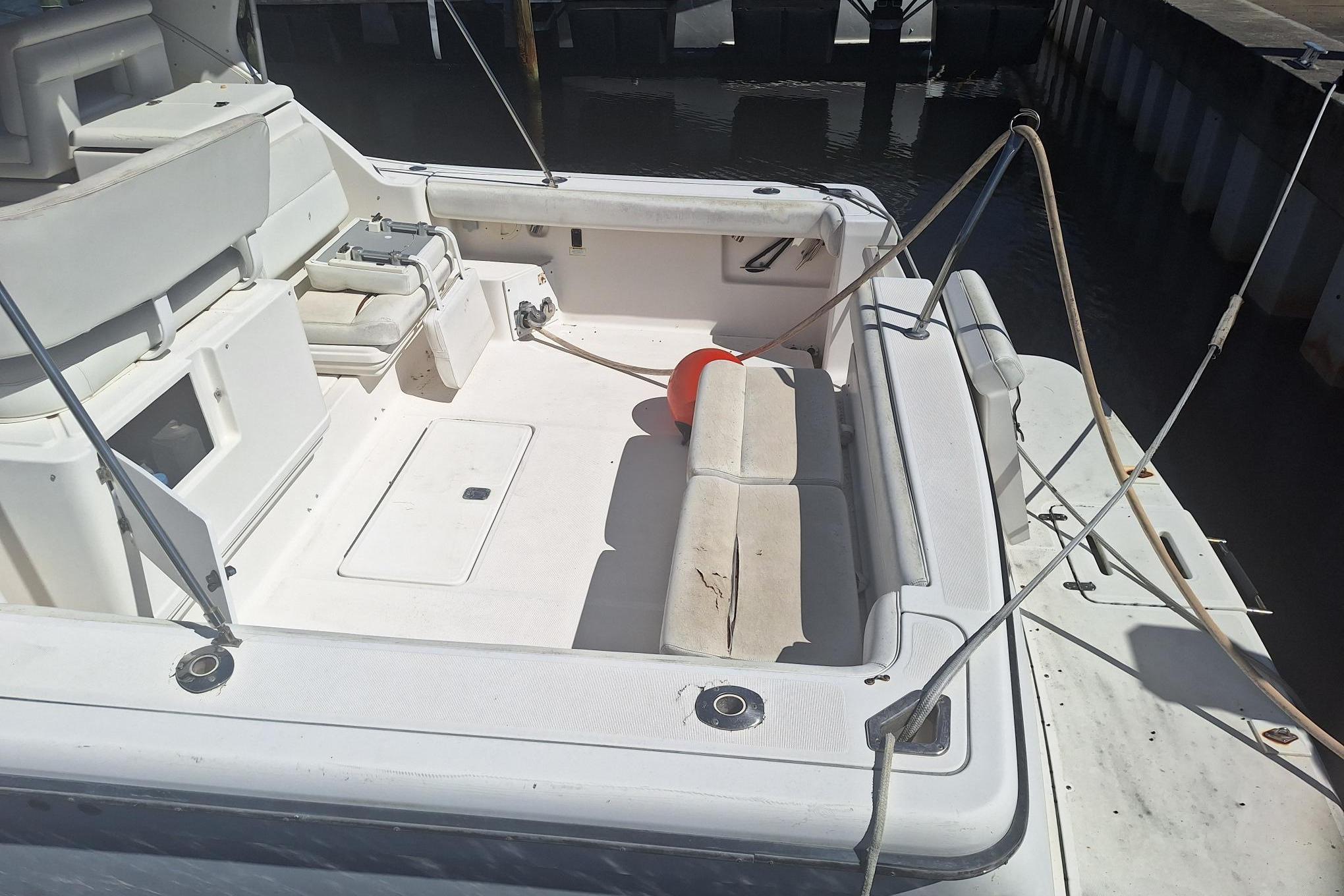 2002 Tiara Yachts 3500 Open boat deck with seating and storage compartments.