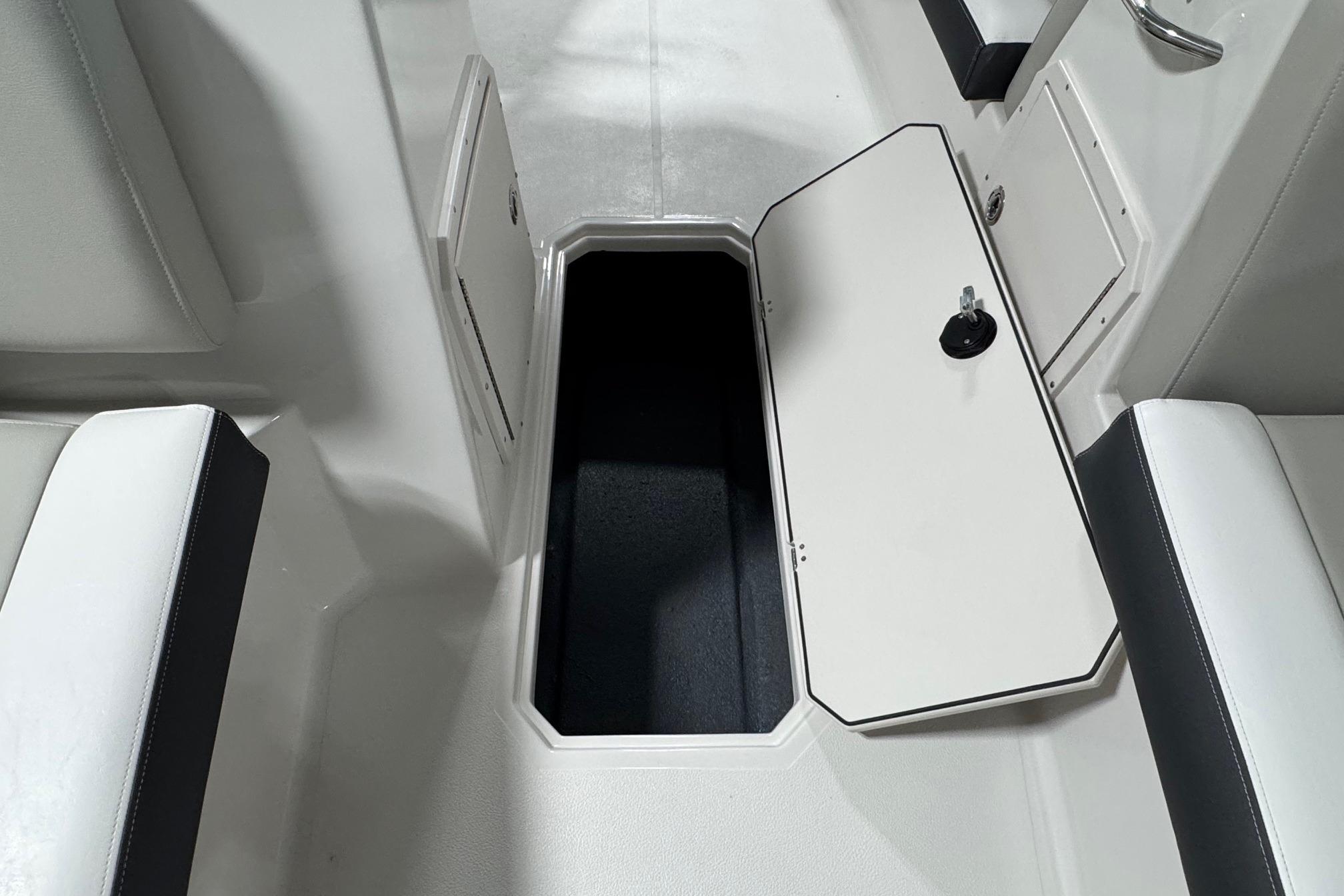2026 Starcraft SVX 191 OB boat interior storage compartment with open hatch.