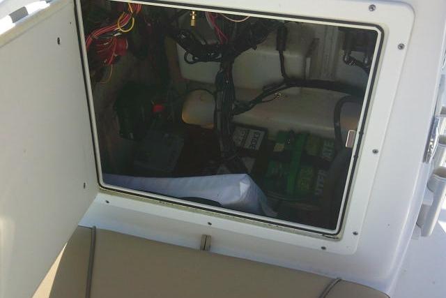 2017 Sportsman Masters 207 Bay Boat interior wiring and battery compartment.