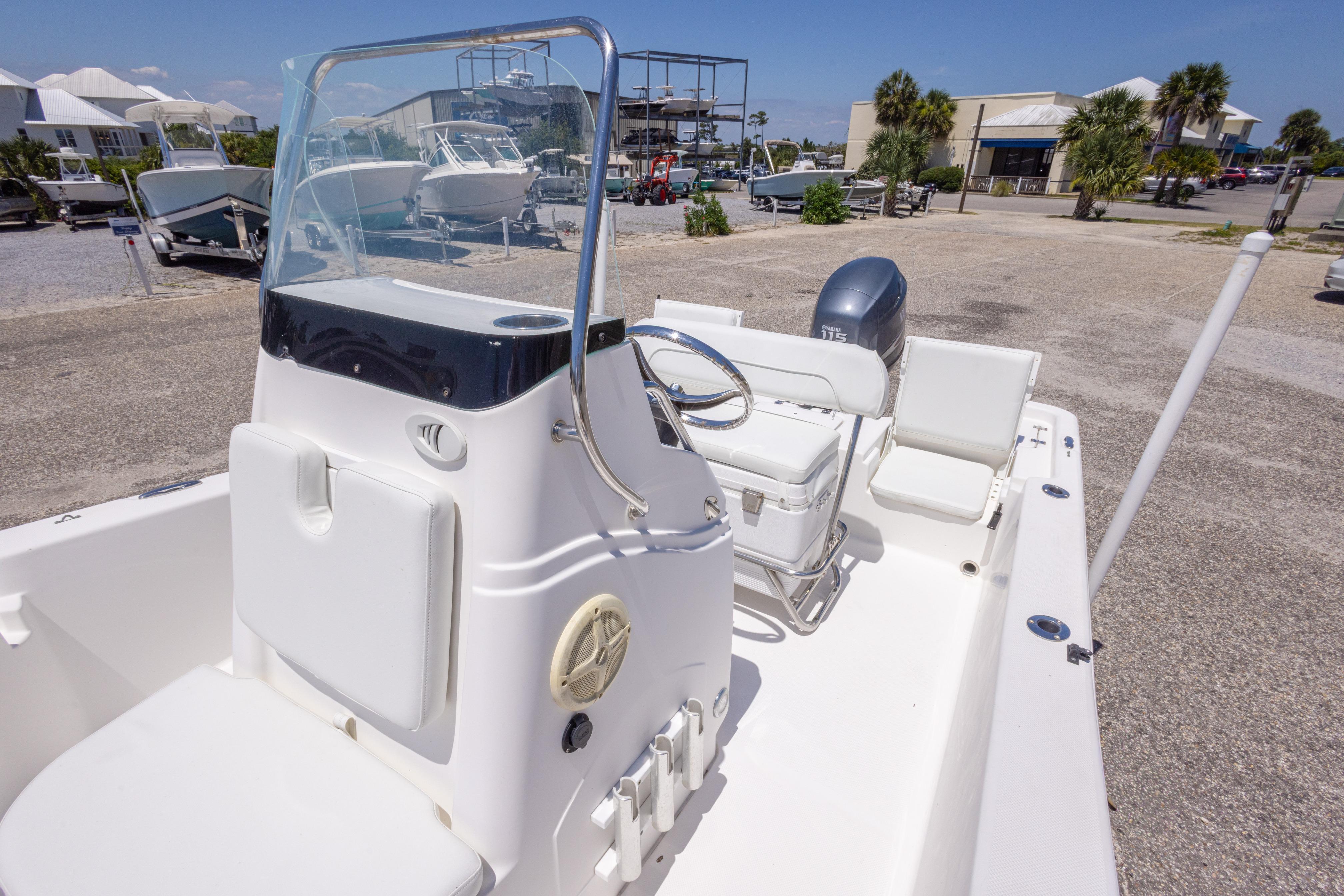 2011 Sea Fox 200XT boat with center console and outboard motor in a marina setting.