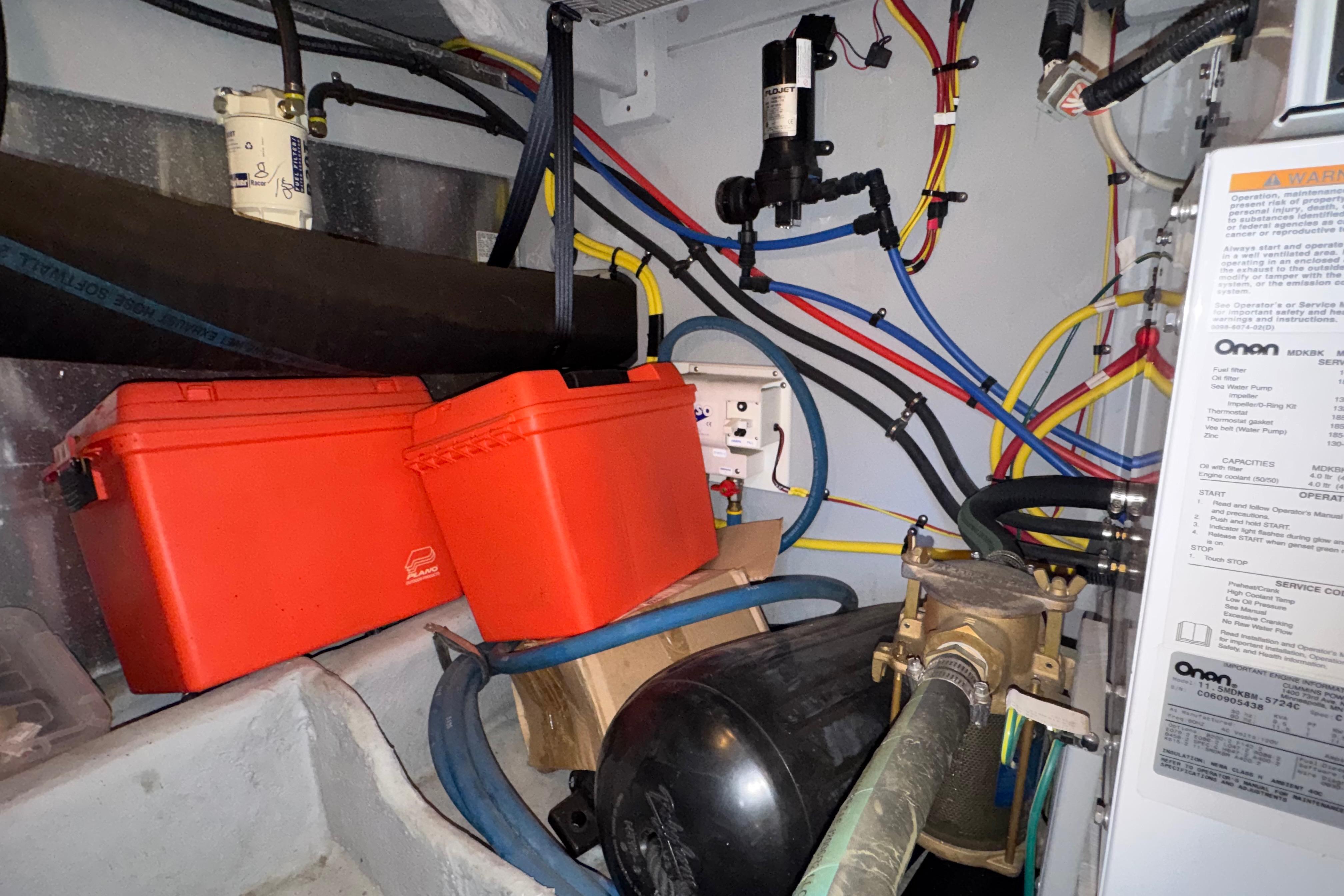 Engine room of a 2007 Meridian 411 Sedan with wiring and equipment.