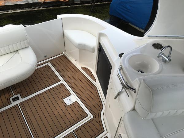 Interior of a 2004 Cruisers Yachts 3372 Express with wood-look flooring.