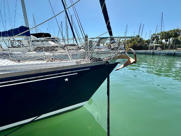 Concordia 52 sailboat, 1989 model, docked in a marina with calm green water.