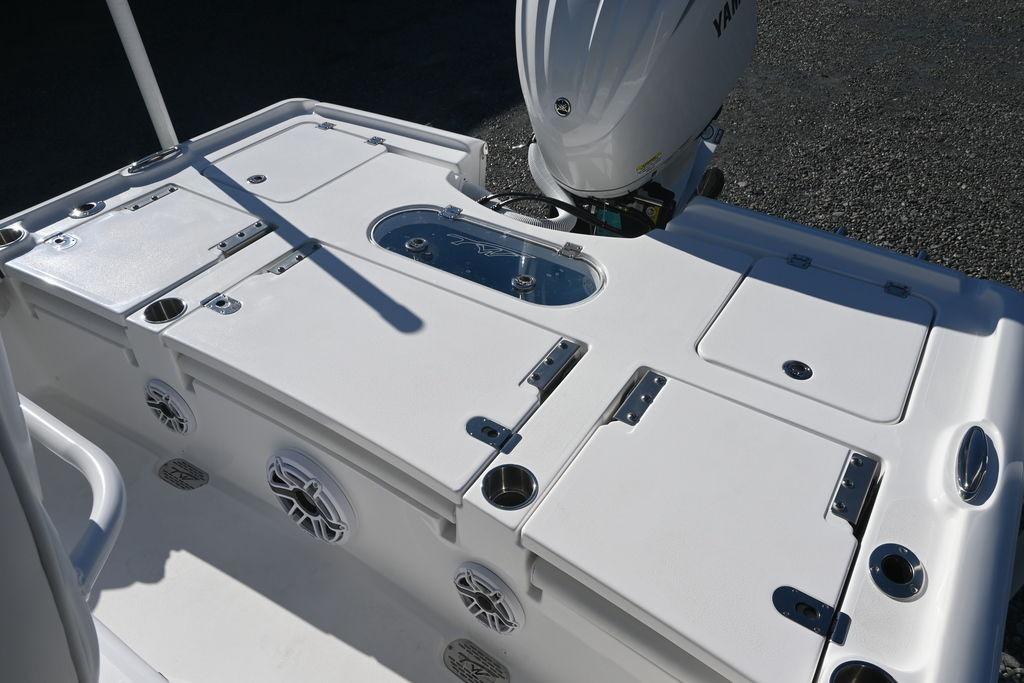2026 Tidewater 2500 Carolina Bay boat deck with storage compartments and Yamaha outboard motor.