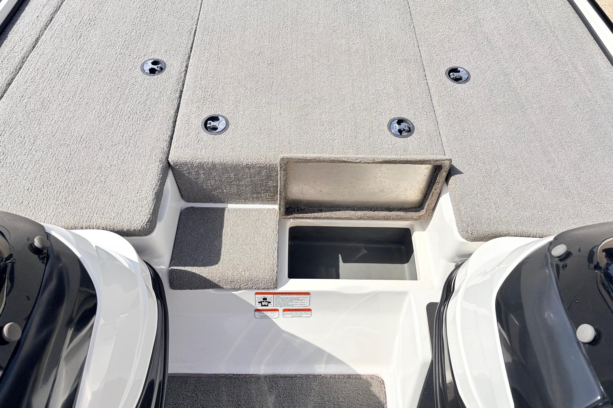 2011 Nitro Z-7 boat deck with storage compartments and dual engines.