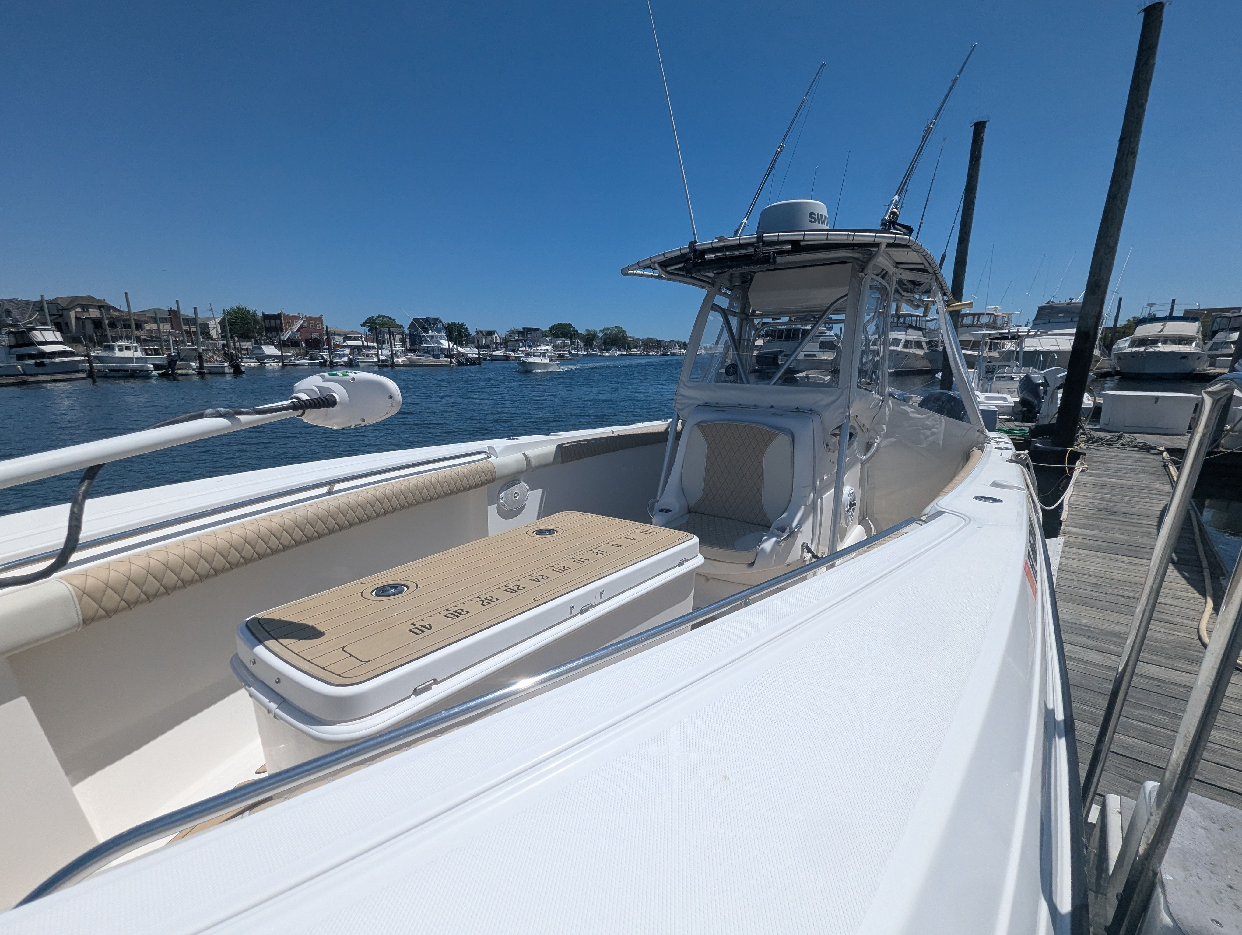 2005 Wellcraft 35 CCF boat docked at marina, sunny day.