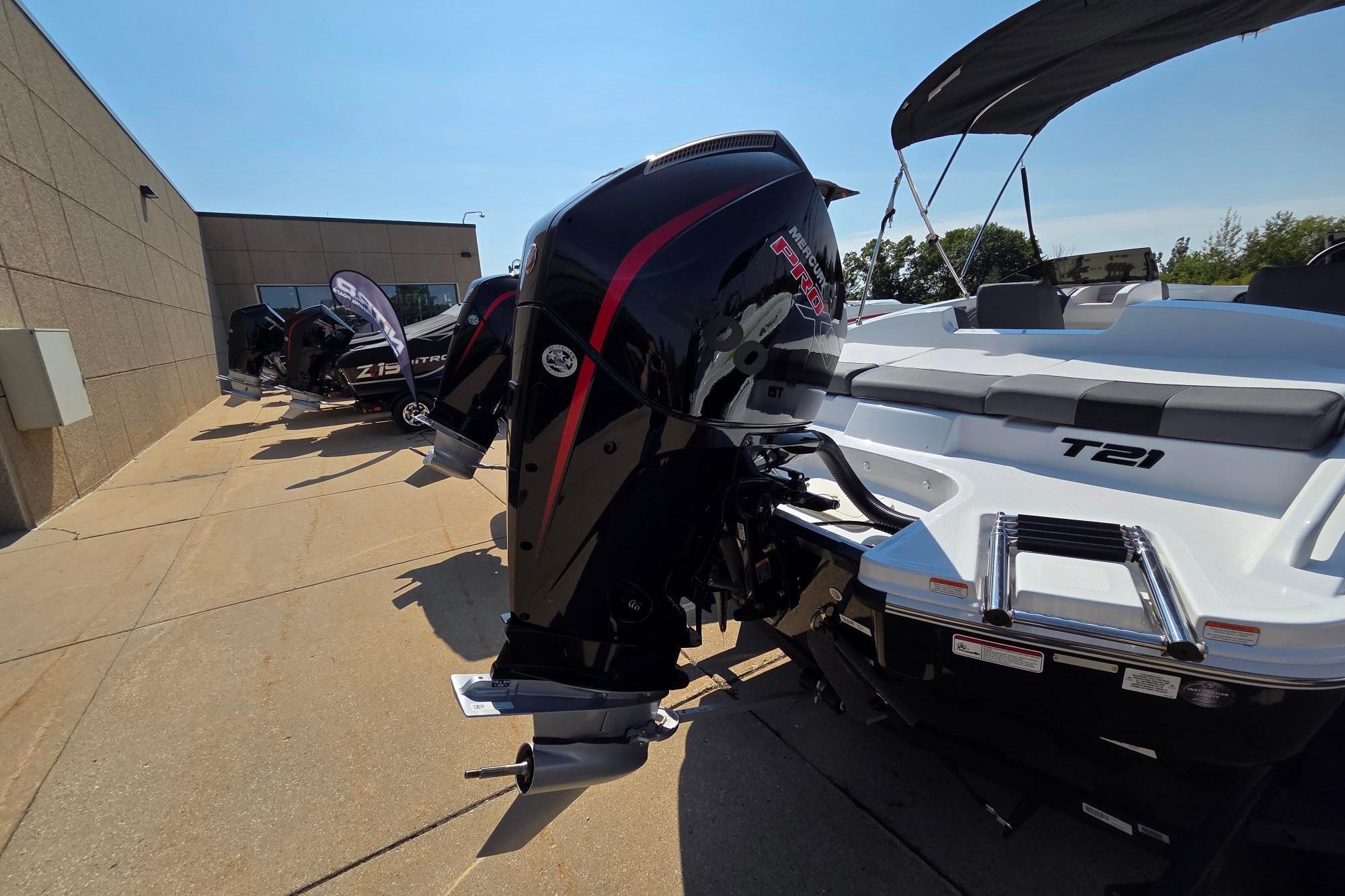 2025 Tahoe T21 boat with Mercury Pro XS engine displayed outdoors.