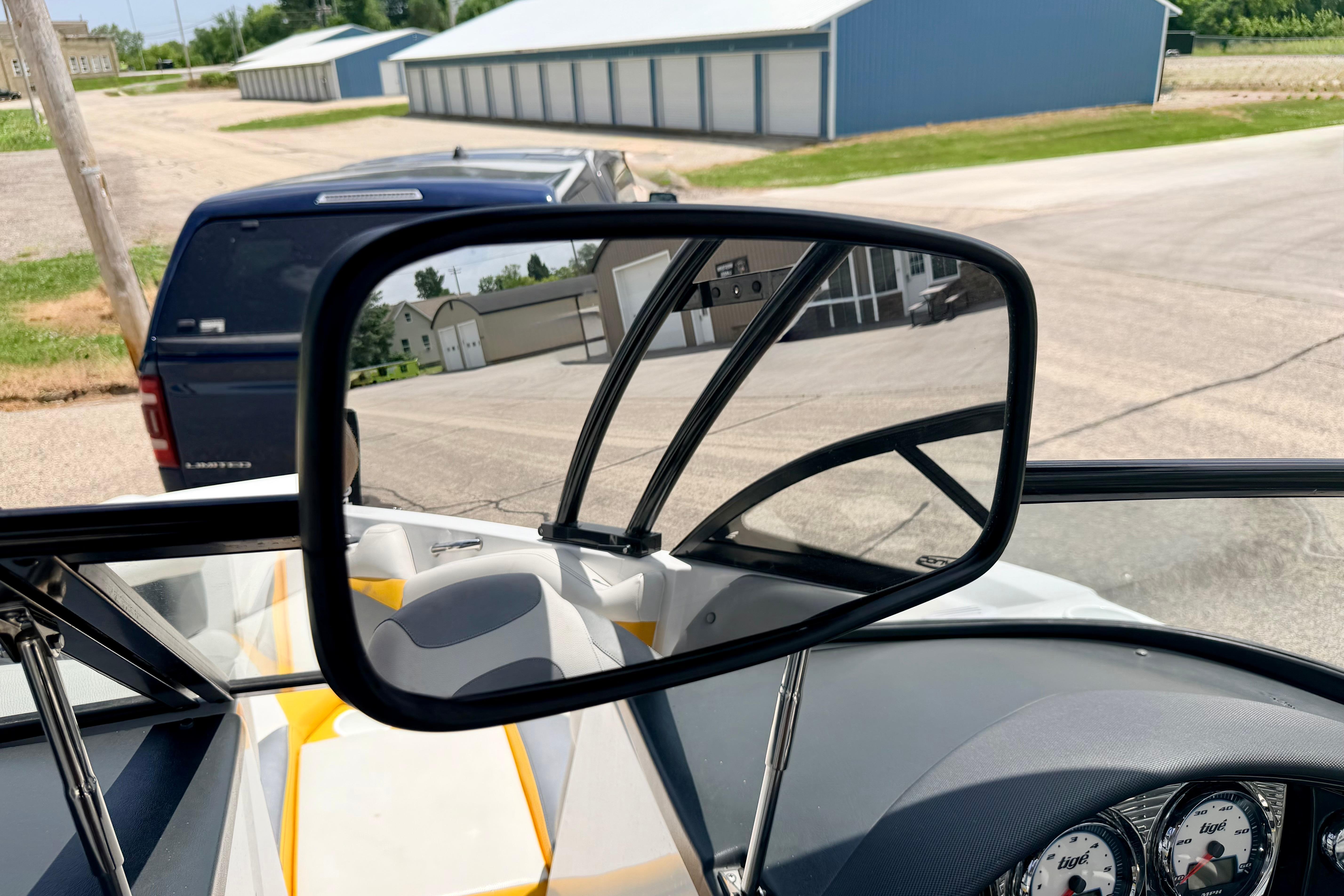 2014 Tigé R20 boat interior with rearview mirror and dashboard gauges.