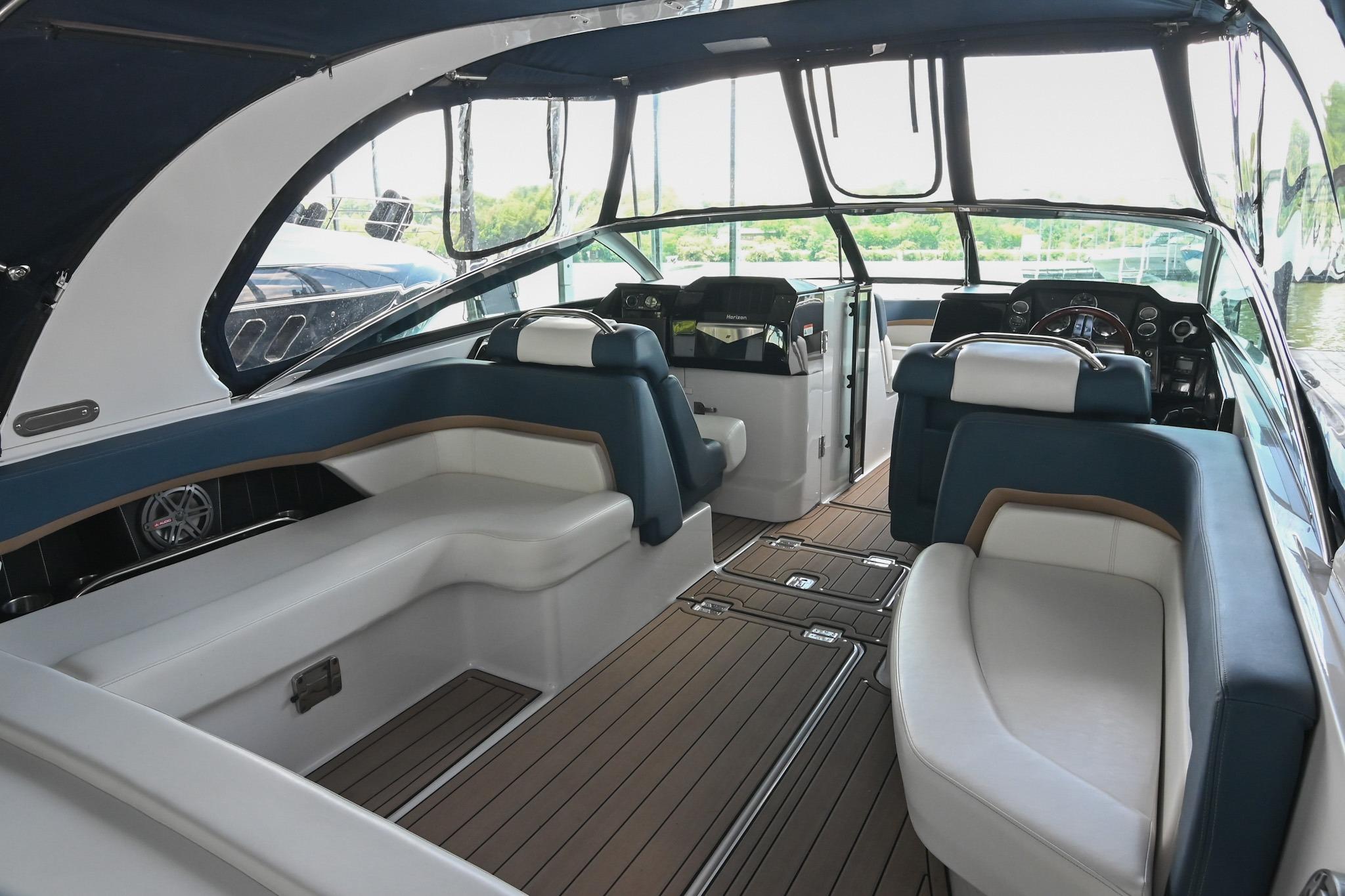 Interior of 2014 Four Winns H290 boat with spacious seating and modern design.