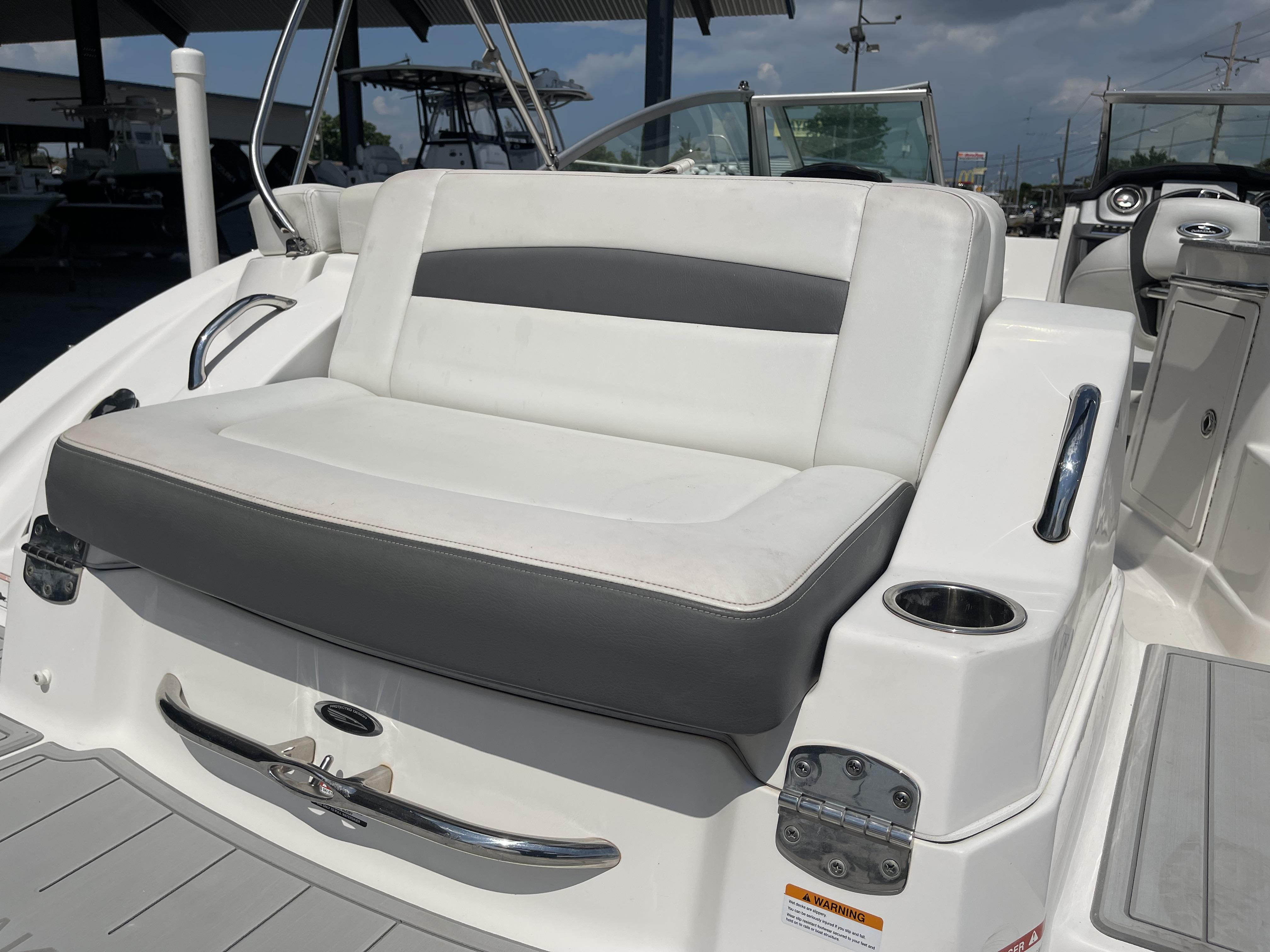 2014 Chaparral Sunesta 224 boat interior with white and gray seating.