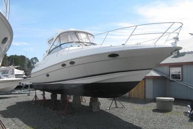 2006 Regal Commodore 3560 yacht on stands, displayed outdoors.