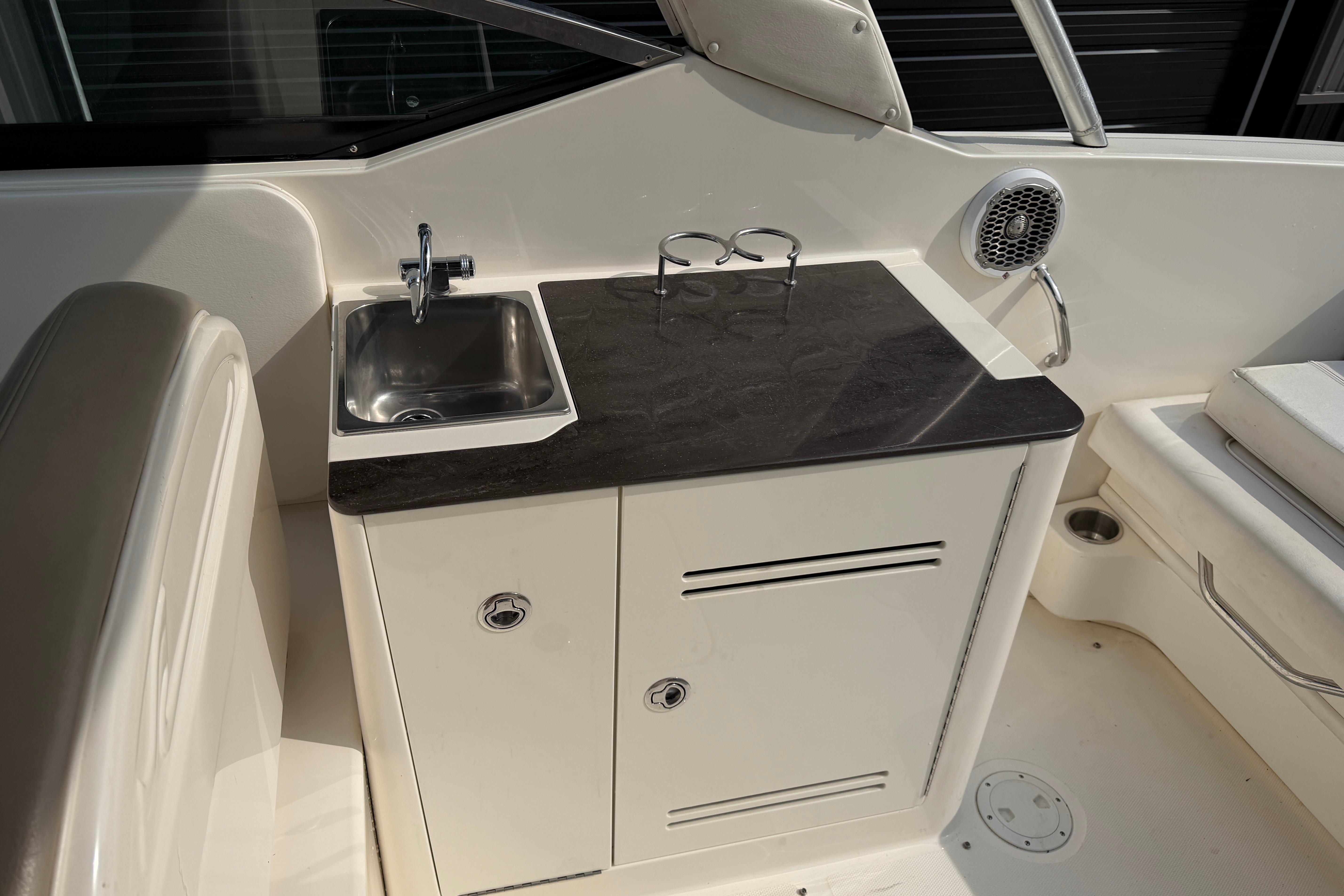 2013 Sea Ray 300 SLX boat interior with sink, countertop, and speaker.