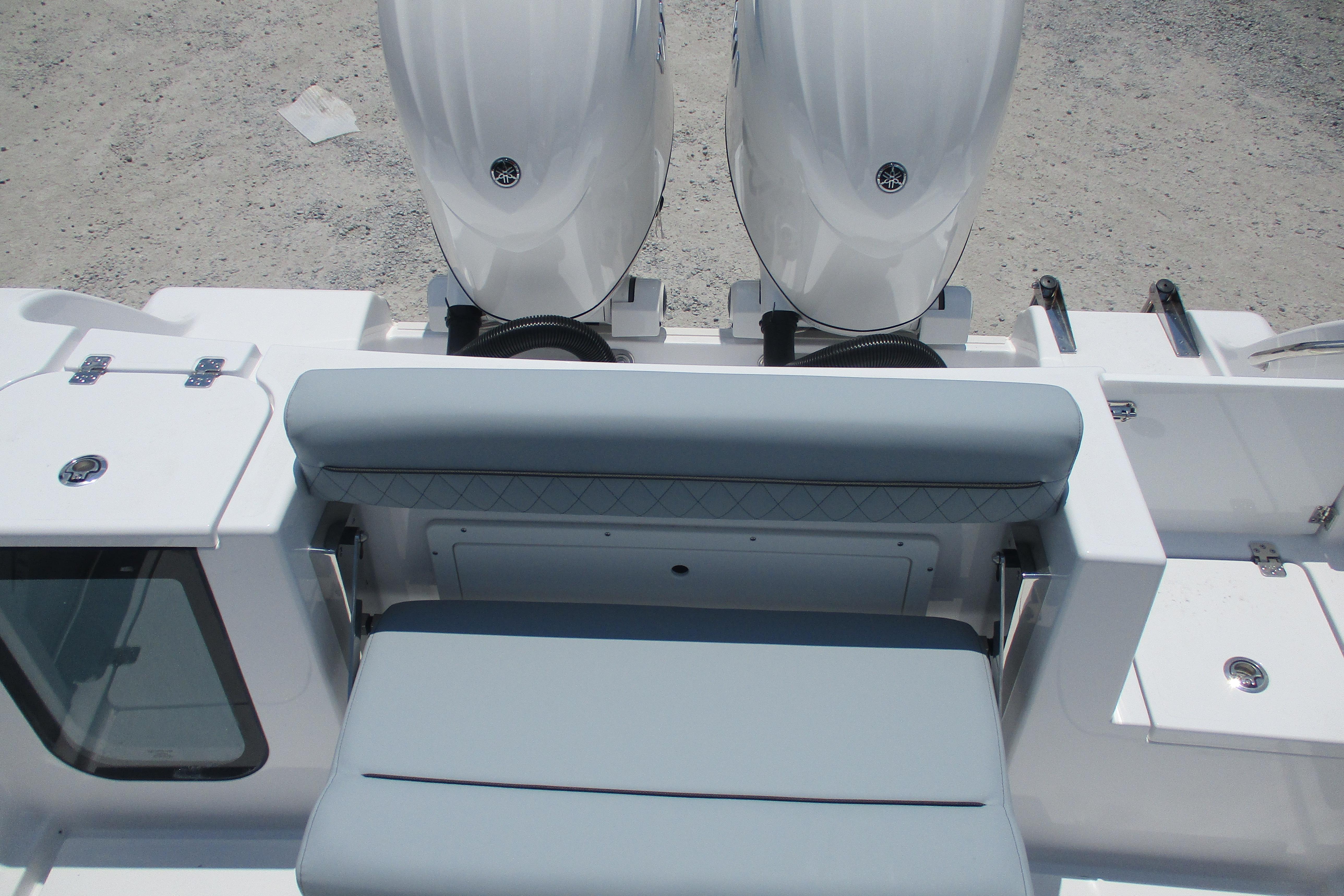 2027 Sportsman Open 252 Center Console boat with dual engines and cushioned seating.