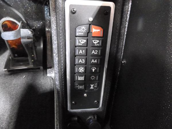 Control panel of a 2025 Ranger Z520 boat with various function buttons.