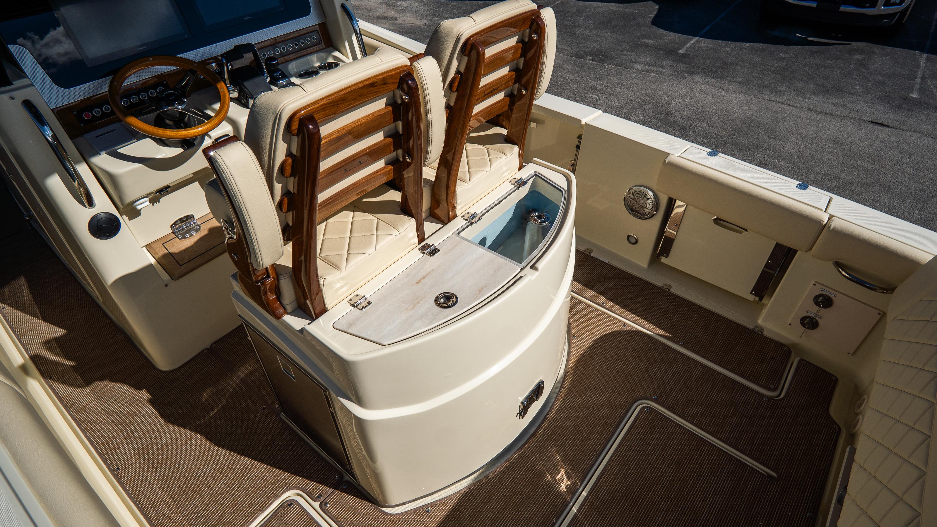 2025 Chris-Craft Catalina 30 interior with luxurious seating and modern dashboard.