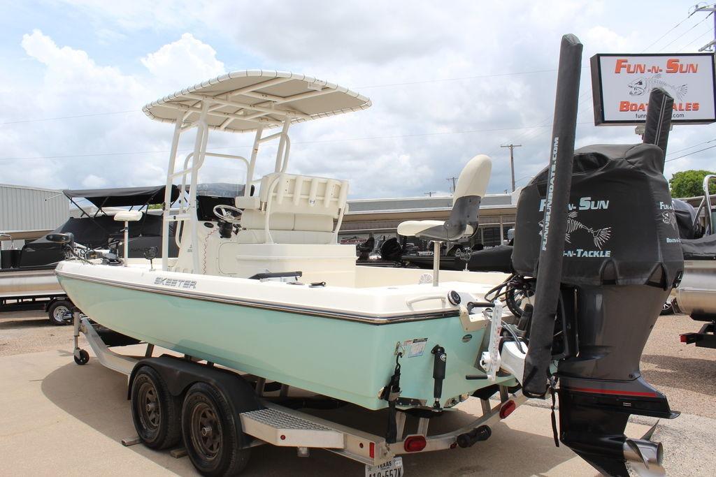 2026 Skeeter SX230 boat on trailer at Fun-n-Sun Boat Sales dealership.