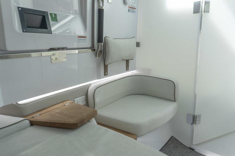 Interior of 2026 Axopar 37 XC Cross Cabin, featuring modern seating and sleek design.