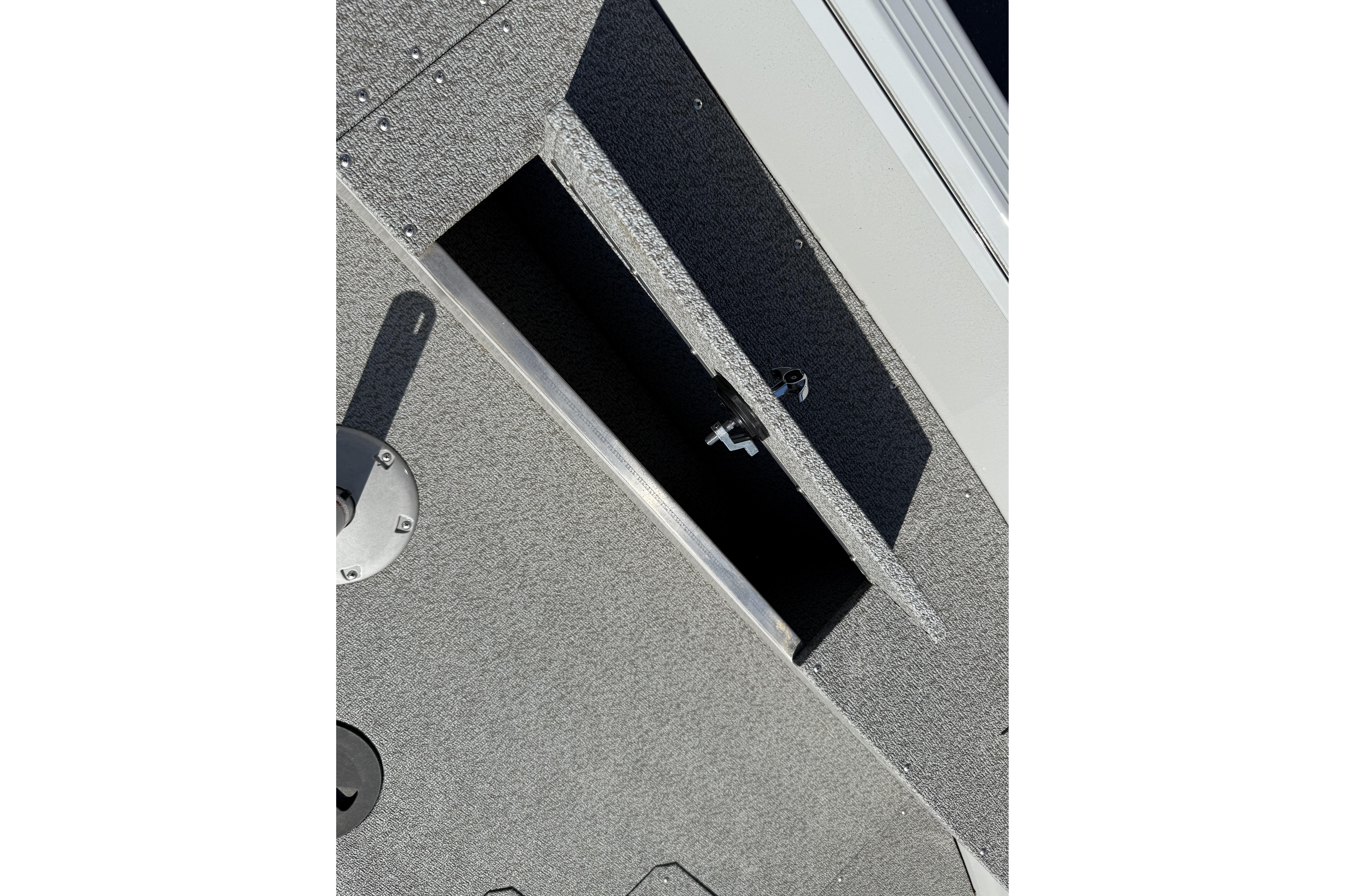 2024 Smoker Craft Freedom 180 TL boat storage compartment with textured surface.