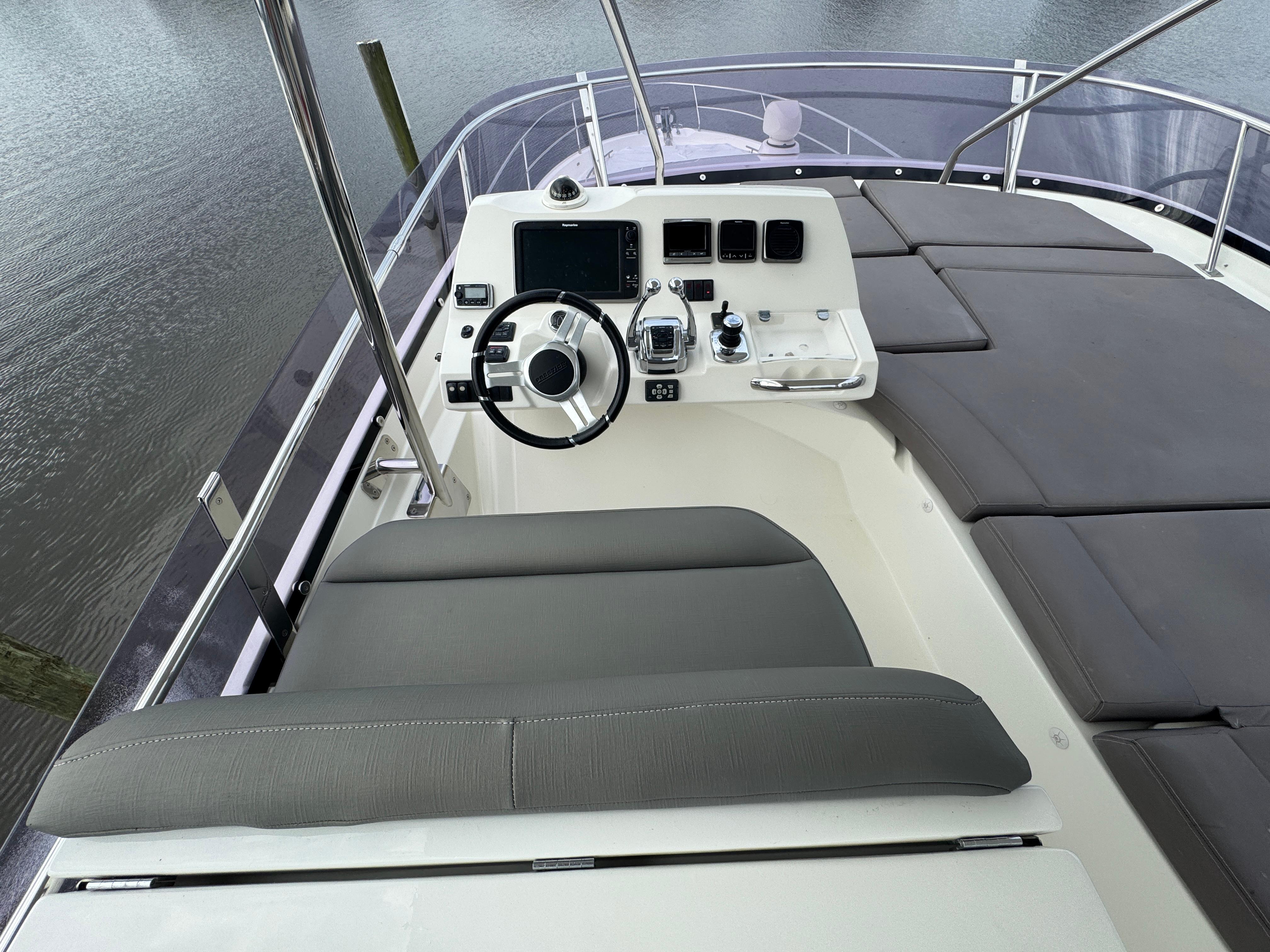 Helm station of a 2016 Prestige 550 yacht.