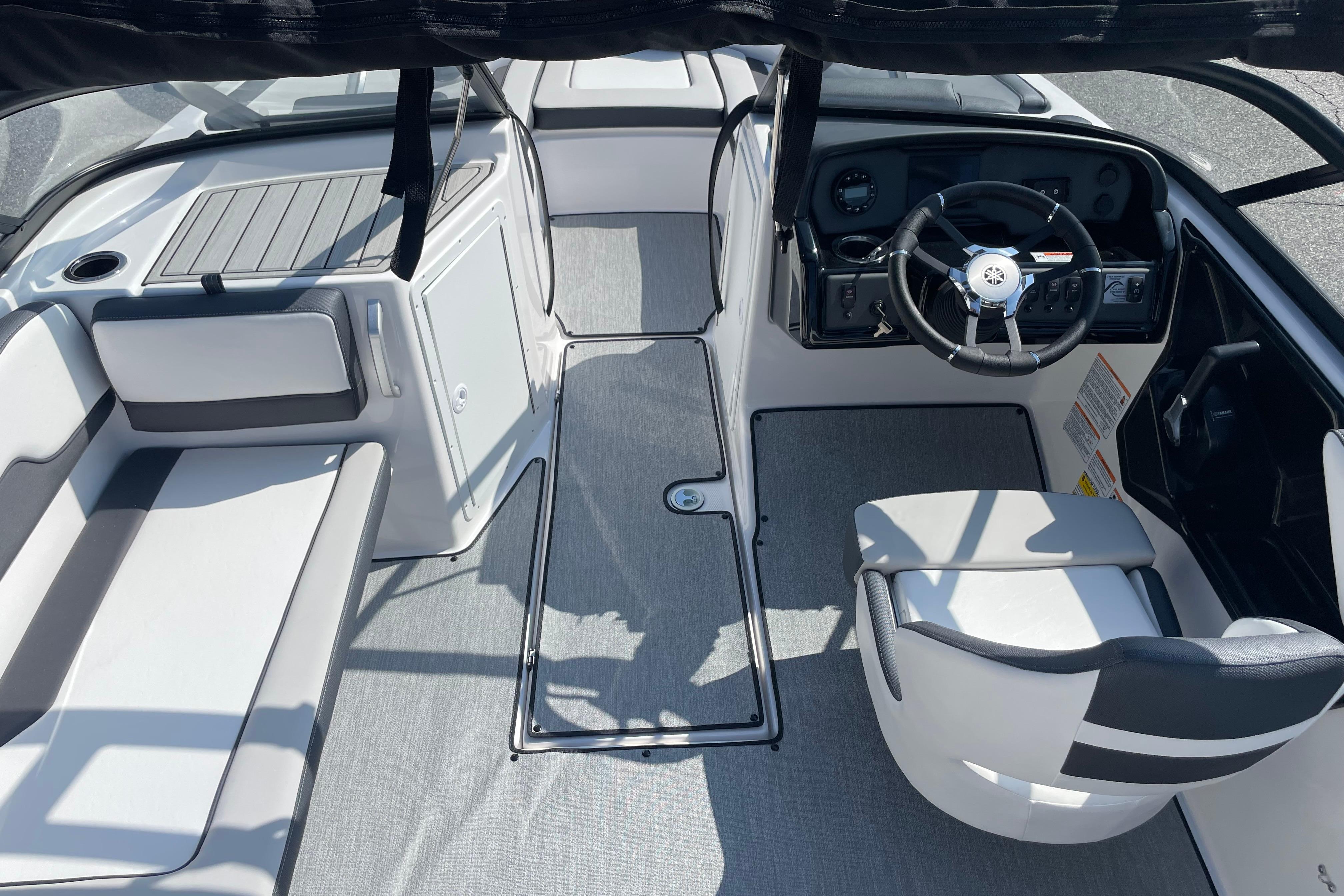 2026 Yamaha Boats AR195 interior with sleek seating and modern steering console.