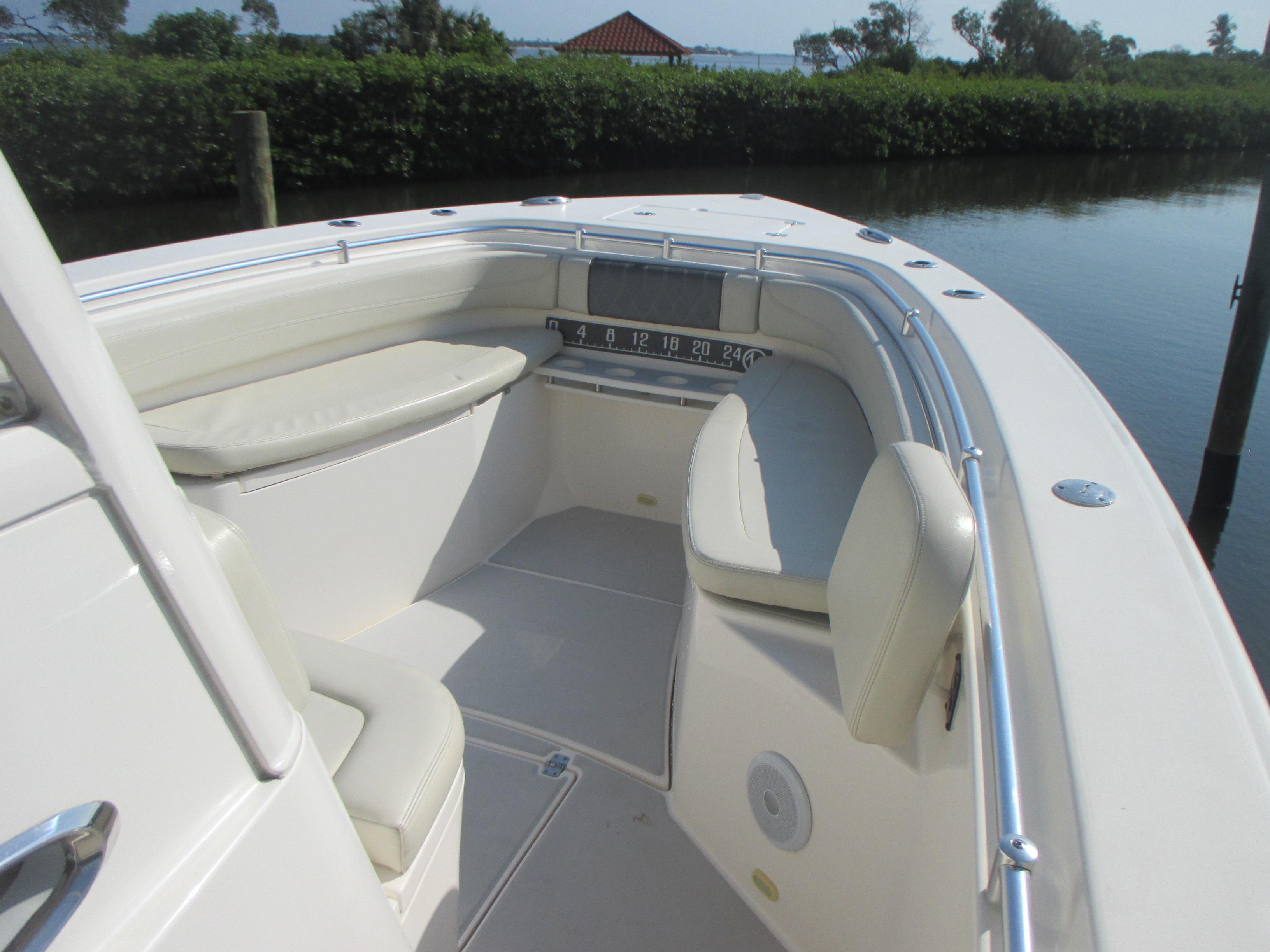 2018 Cobia 301 Center Console boat interior with cushioned seating and sleek design.