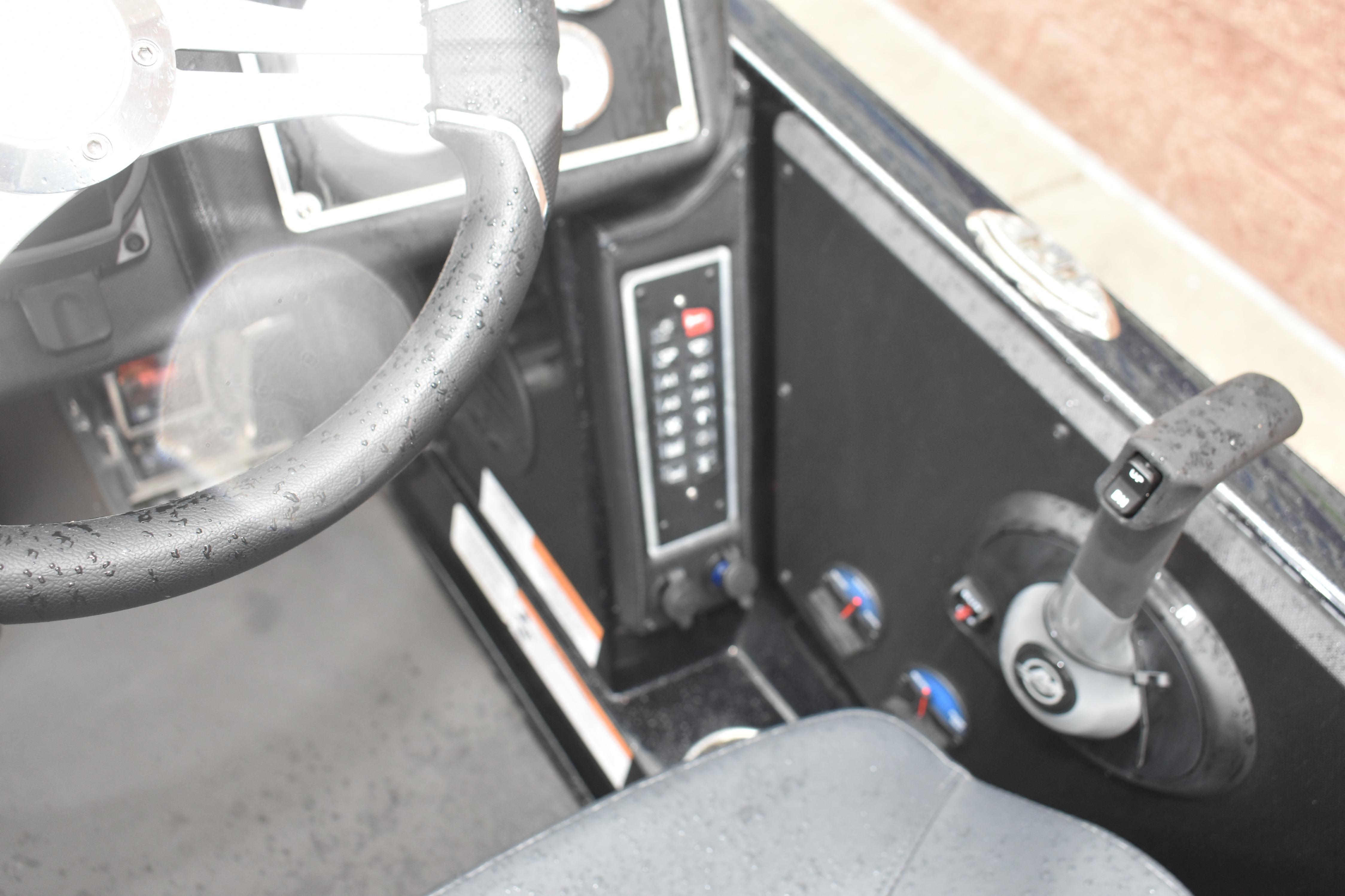 2025 Ranger Z521 boat cockpit with steering wheel and control panel, featuring modern design elements.