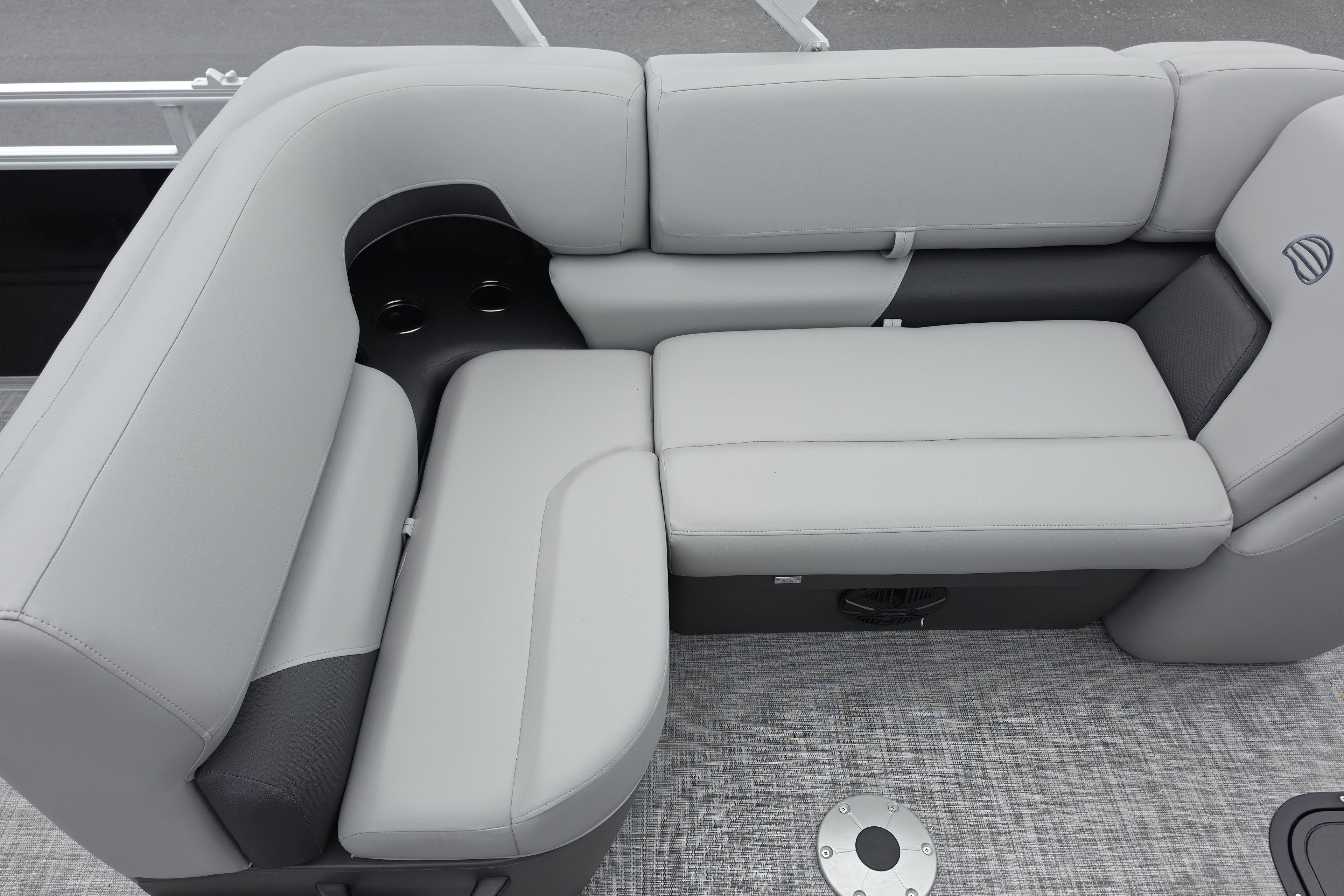 2026 Sun Tracker SportFish 22 XP3 boat interior with gray cushioned seating.