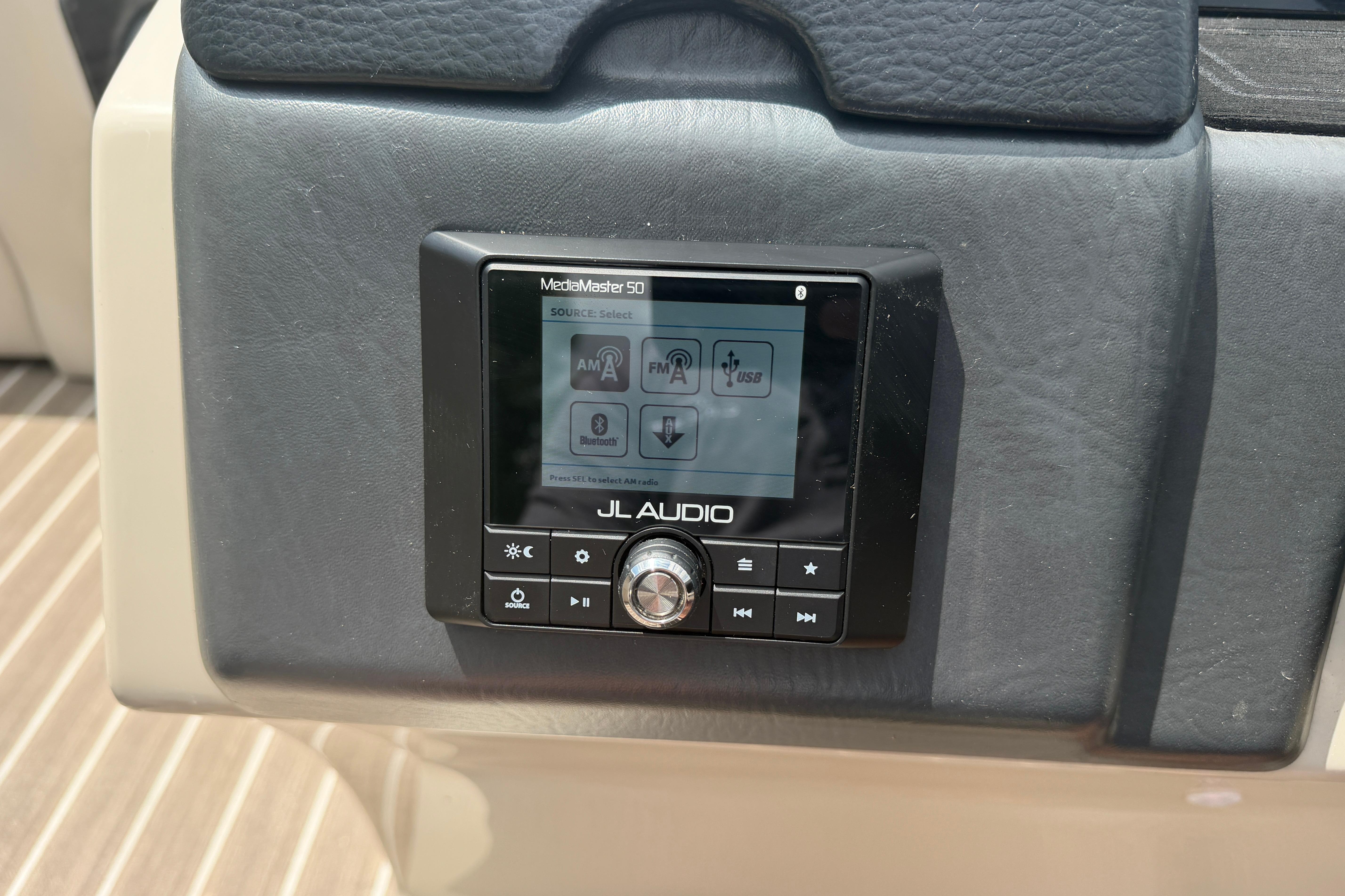 JL Audio MediaMaster 50 control panel on 2019 Harris Solstice 240 boat dashboard.